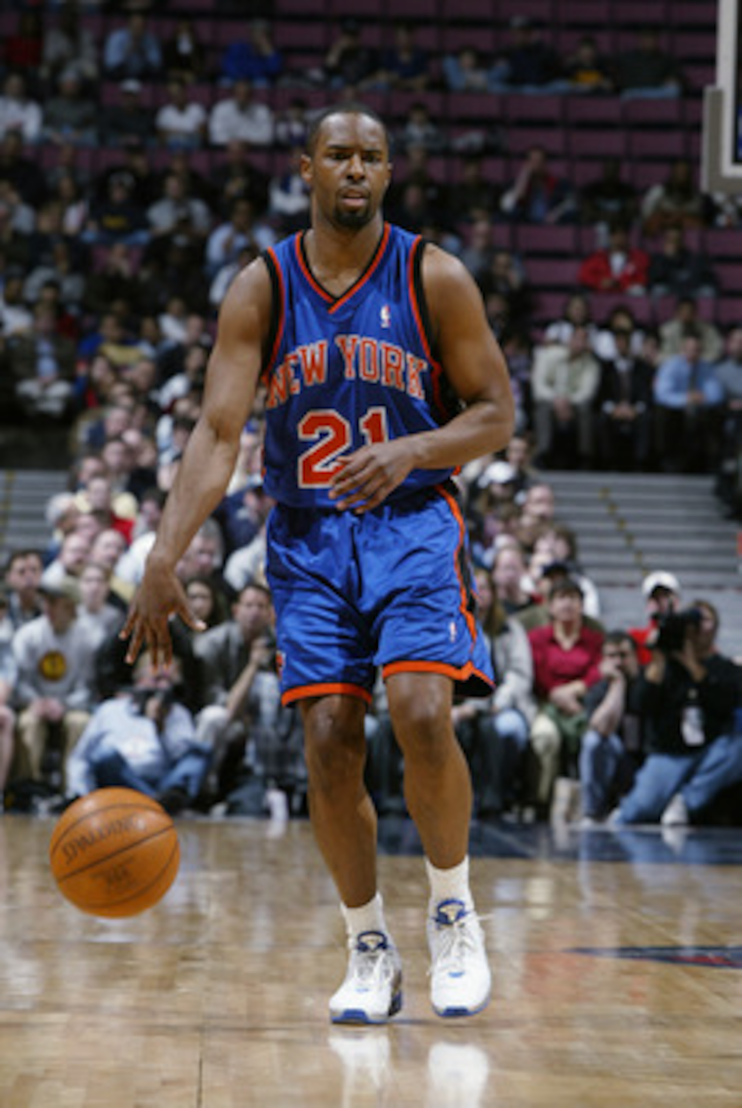 EAST RUTHERFORD, NJ - MARCH 26:  Charlie Ward #21 of the New York Knicks brings the ball forward during the NBA game against the New Jersey Nets at Continental Airlines Arena on March 26, 2003 in East Rutherford, New Jersey.  The Nets won 101-95.  NOTE TO