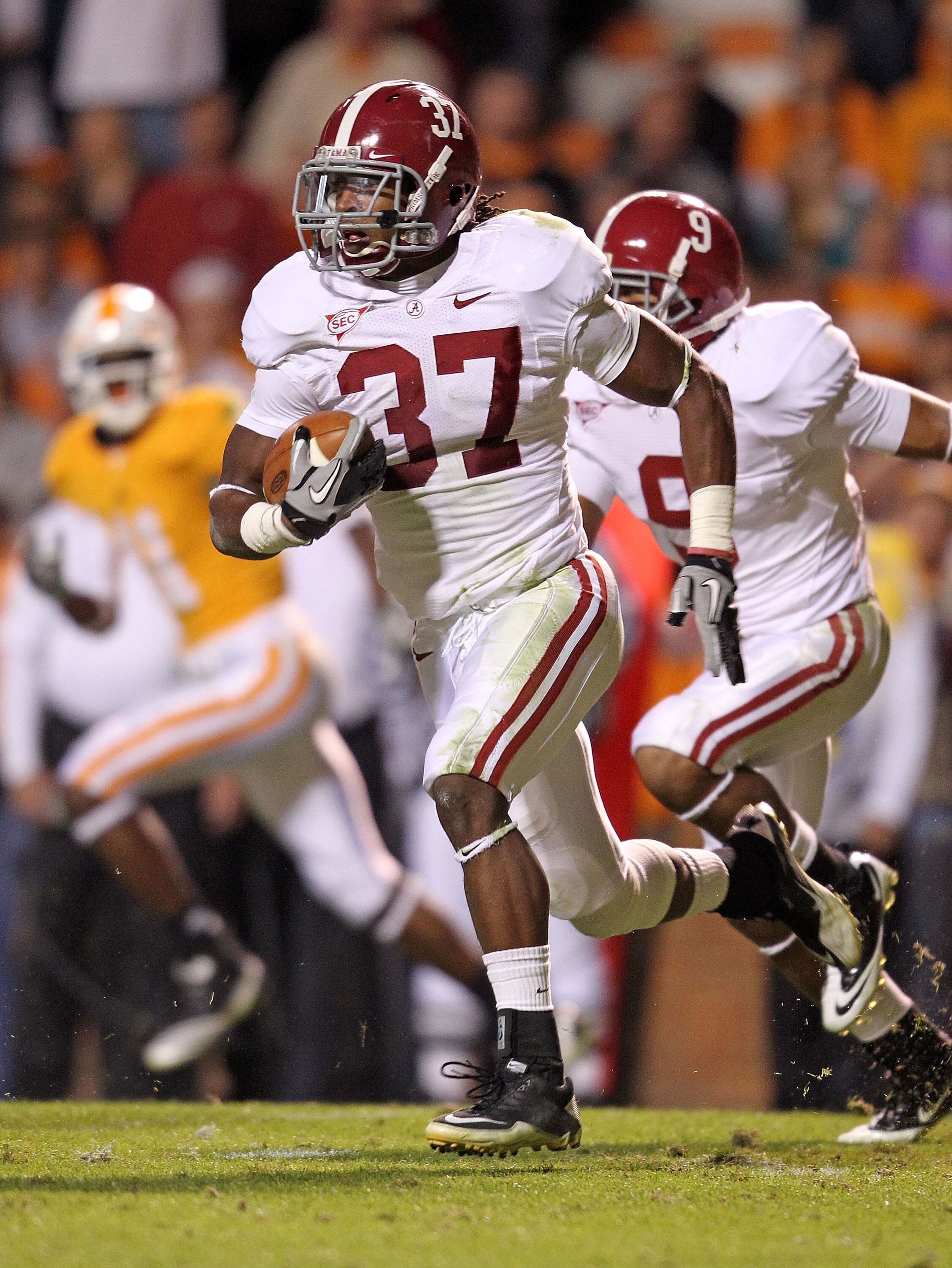 KNOXVILLE, TN - OCTOBER 23:  Robert Lester #37 of the Alabama Crimson Tide runs with the ball after intercepting a pass during the SEC game against the Tennessee Volunteers at Neyland Stadium on October 23, 2010 in Knoxville, Tennessee.  (Photo by Andy Ly