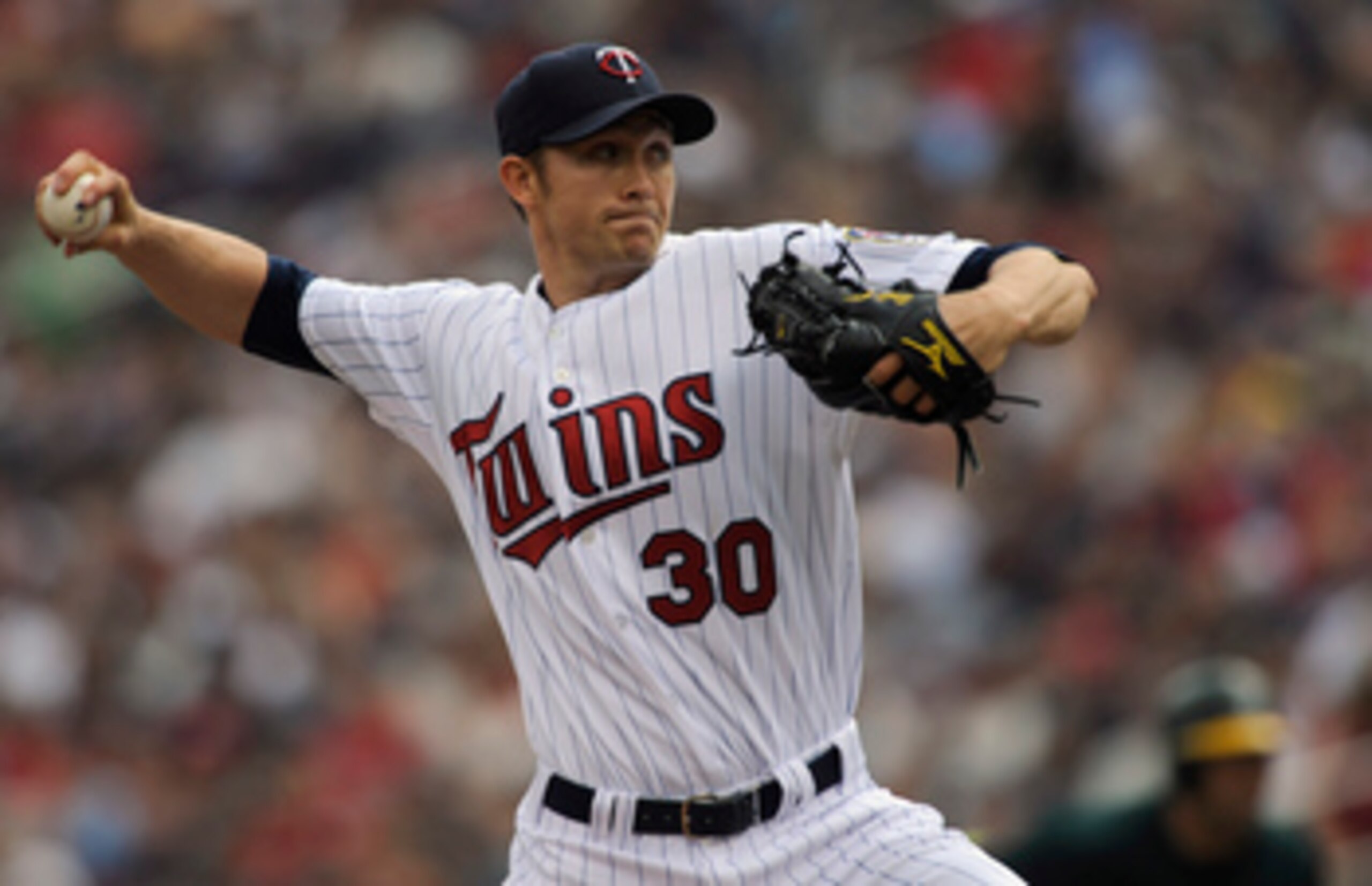 MINNEAPOLIS, MN - APRIL 10: Starting pitcher Scott Baker #30 of the Minnesota Twins throws against the Oakland Athletics during the first inning of a game on April 10, 2011 at Target Field in Minneapolis, Minnesota. (Photo by Hannah Foslien/Getty Images)