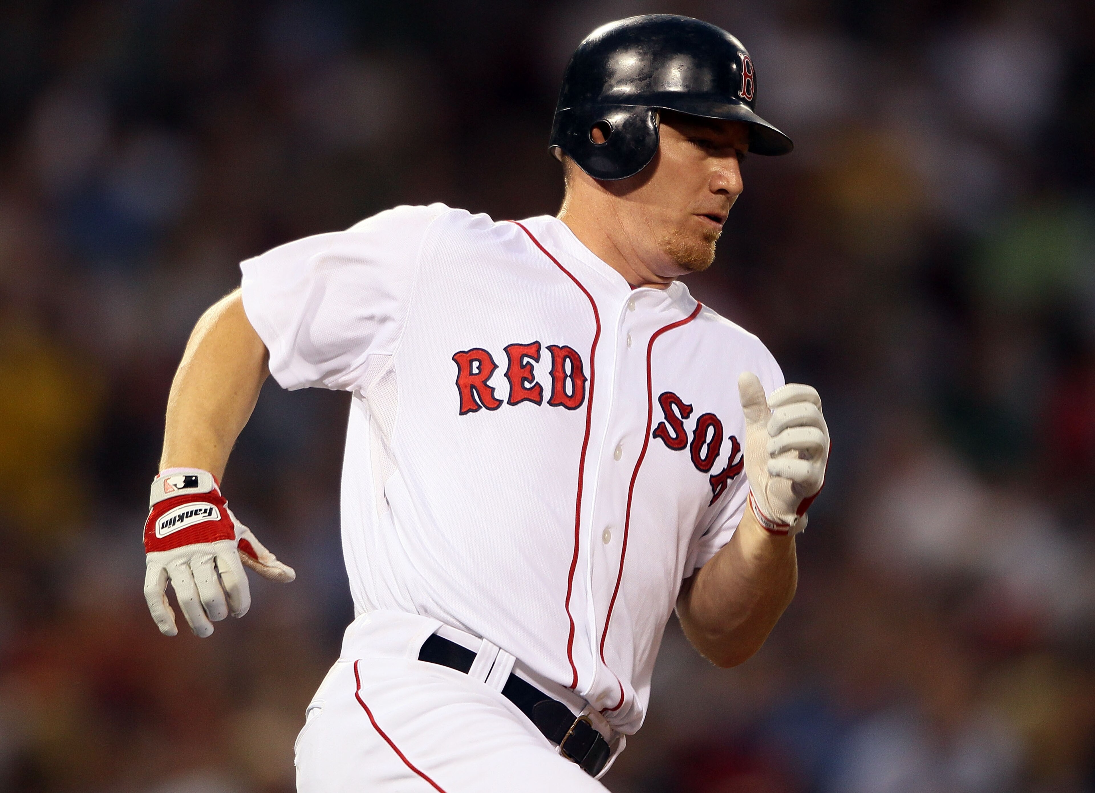 BOSTON - JULY 15:  J.D. Drew #7 of the Boston Red Sox rounds the bases after his solo home run in the fourth inning against the Texas Rangers on July 15, 2010 at Fenway Park in Boston, Massachusetts.  (Photo by Elsa/Getty Images)