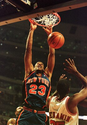 01 Dec 2000: Center Marcus Camby #23 of the New York Knicks slams the ball down while Guard Cory Benjamin #25 of the Chicago Bulls attempts to defend in early action at the United Center in Chicago, Illinois. Mandatory Credit: Jonathan Daniel/ALLSPORT  NO