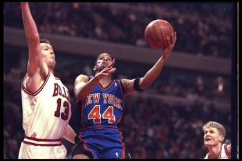 14 May 1996:  Hubert Davis of the New York Knicks goes up for two against center Luc Longley of the Chicago Bulls during a game played at the United Center in Chicago, Illinois.  The Bulls won the game, 94-81. Mandatory Credit: Doug Pensinger/Allsport