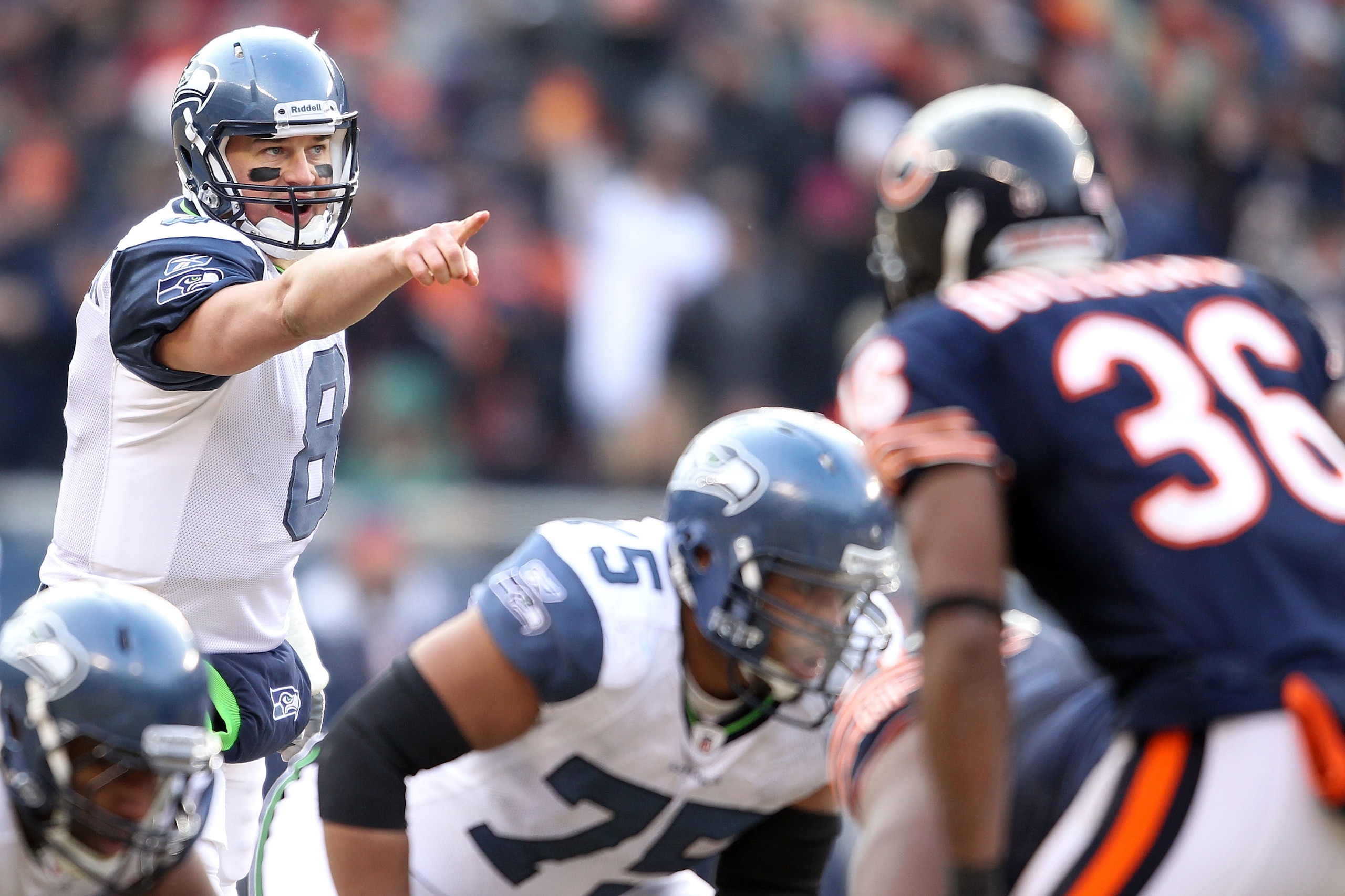 CHICAGO, IL - JANUARY 16:  Quarterback Matt Hasselbeck #8 of the Seattle Seahawks points from under center against the Chicago Bears in the 2011 NFC divisional playoff game at Soldier Field on January 16, 2011 in Chicago, Illinois.  (Photo by Andy Lyons/G