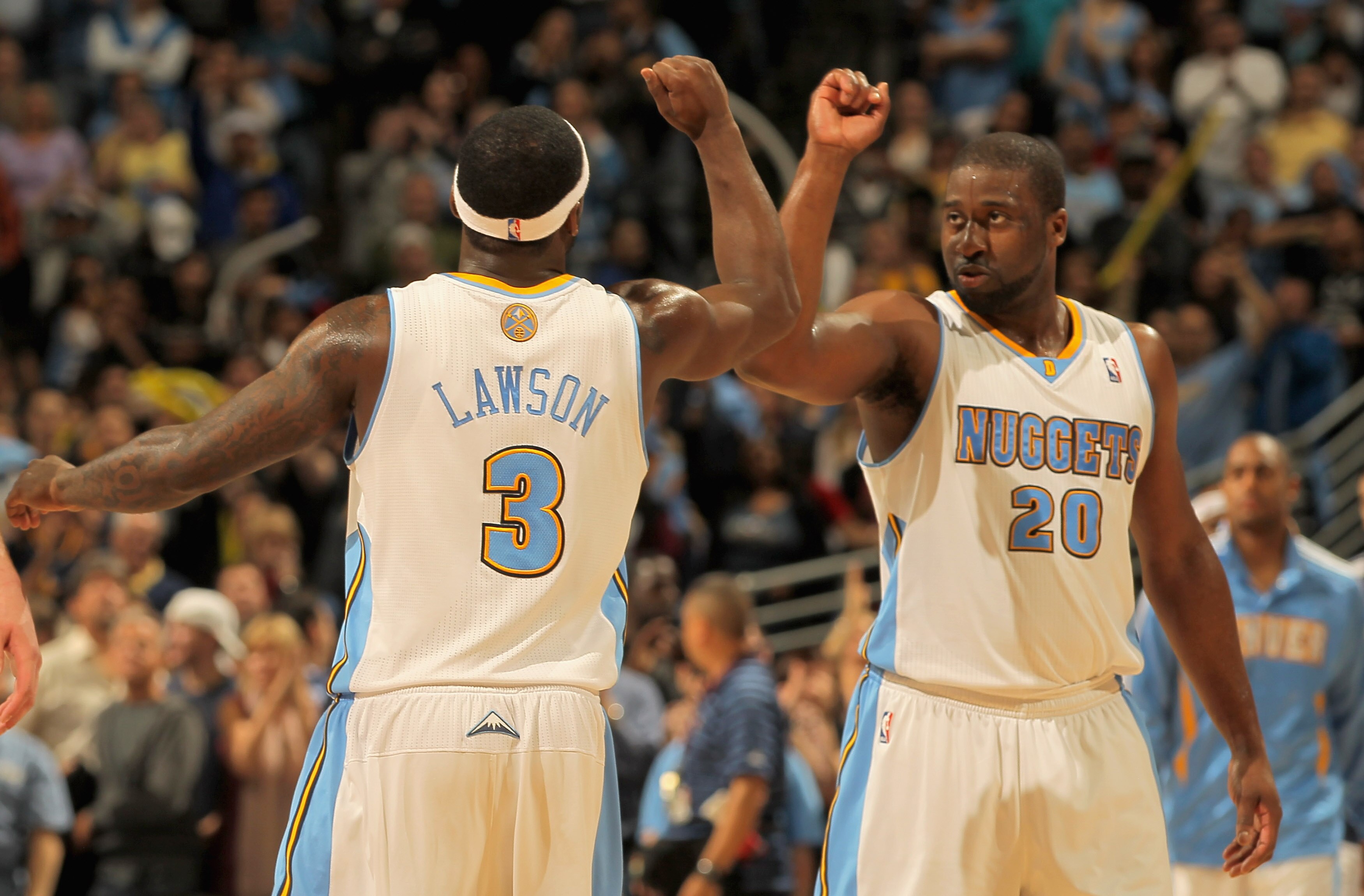 DENVER, CO - APRIL 25:  Ty Lawson #3 of the Denver Nuggets and Raymond Felton #20 of the Denver Nuggets celebrate late in the fourth quarter against the Oklahoma City Thunder in Game Four of the Western Conference Quarterfinals in the 2011 NBA Playoffs on
