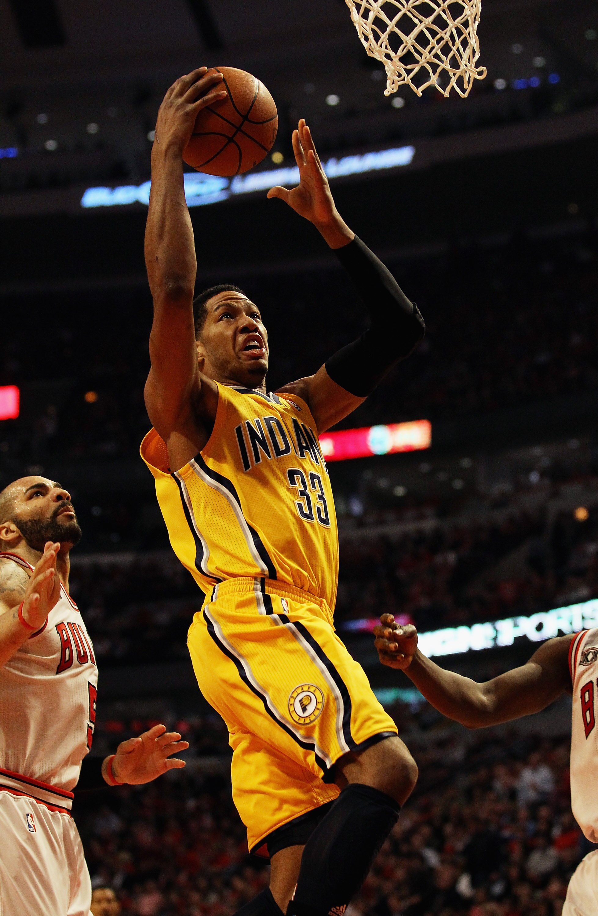 CHICAGO, IL - APRIL 26: Danny Granger #33 of the Indiana Pacers drives to the basket past Carlos Boozer #5 of the Chicago Bulls in Game Five of the Eastern Conference Quarterfinals in the 2011 NBA Playoffs at the United Center on April 26, 2011 in Chicago