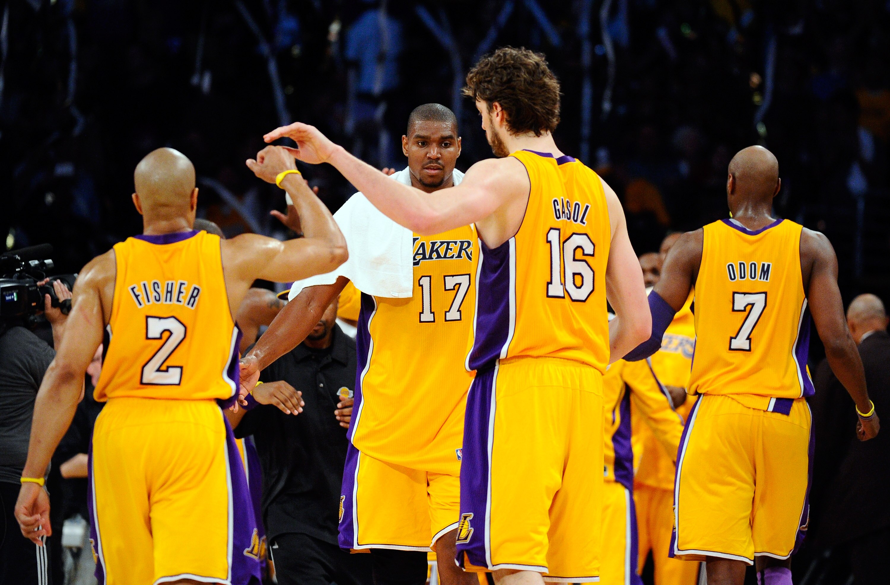 LOS ANGELES, CA - APRIL 20:  (R-L) Derek Fisher #2, Andrew Bynum #17 and Pau Gasol #16 of the Los Angeles Lakers celebrate while taking on the New Orleans Hornets in Game Two of the Western Conference Quarterfinals in the 2011 NBA Playoffs on April 20, 20