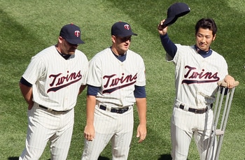 MINNEAPOLIS, MN - APRIL 08:  Tsuyoshi Nishioka #1 of the Minnesota Twins salutes the cheering fans during introductions before Opening Day against the Oakland Athletics  on April 8, 2011 at Target Field in Minneapolis, Minnesota.  (Photo by Elsa/Getty Ima