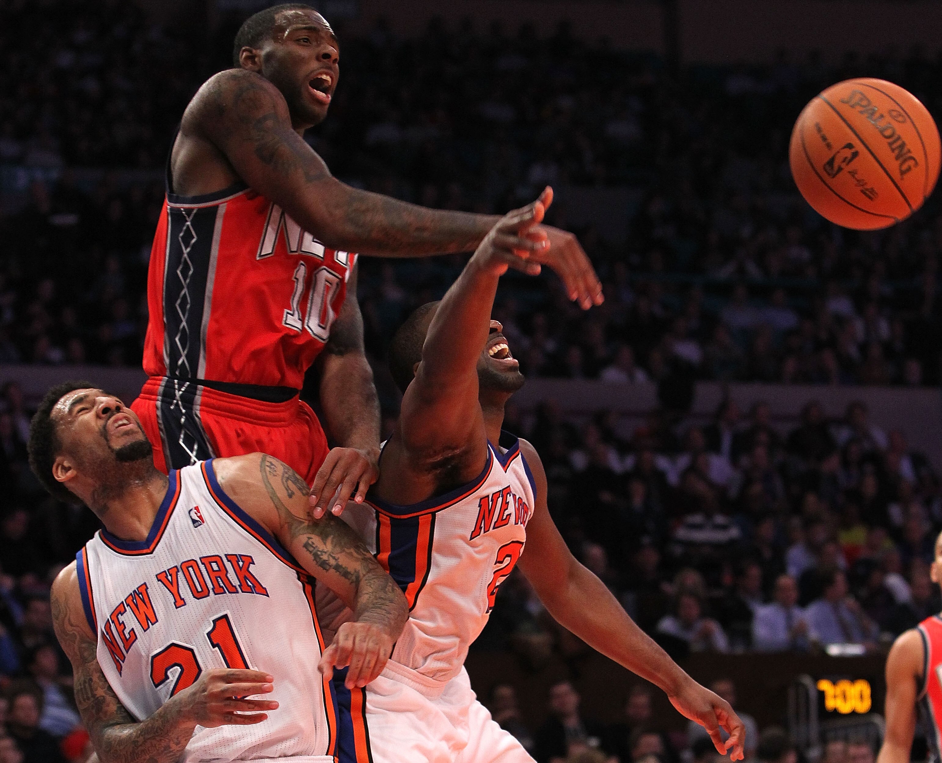 NEW YORK, NY - NOVEMBER 30:  Raymond Felton #2 of the New York Knicks has his shot blocked by Damion James #10 of the New Jersey Nets on November 30, 2010 at Madison Square Garden in New York City. NOTE TO USER: User expressly acknowledges and agrees that