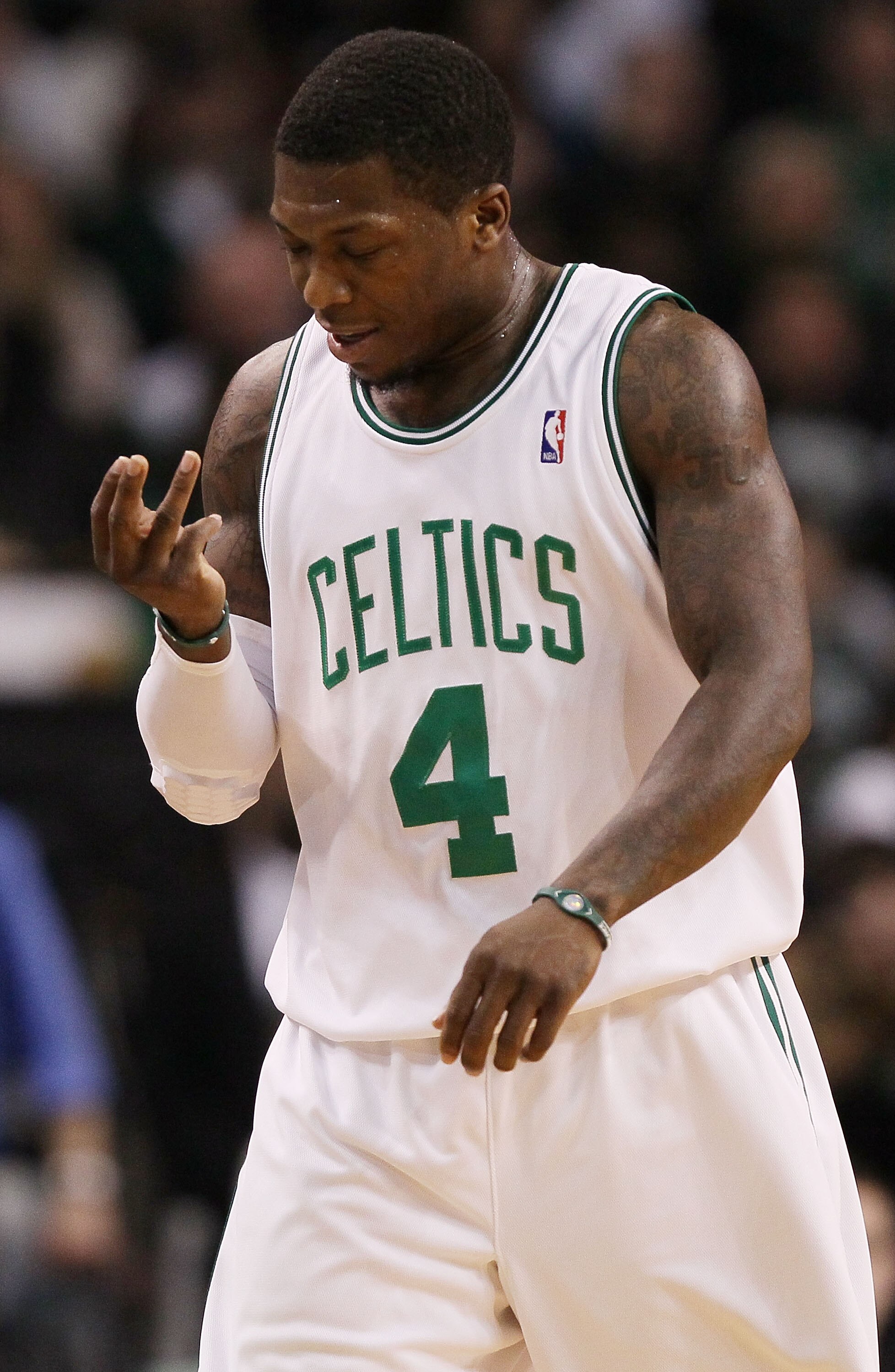 BOSTON - MARCH 31:  Nate Robinson #4 of the Boston Celtics checks his hand as he walks off the court the fourth quarter against the Oklahoma City Thunder on March 31, 2010 at the TD Garden in Boston, Massachusetts. The Oklahoma City Thunder defeated the B