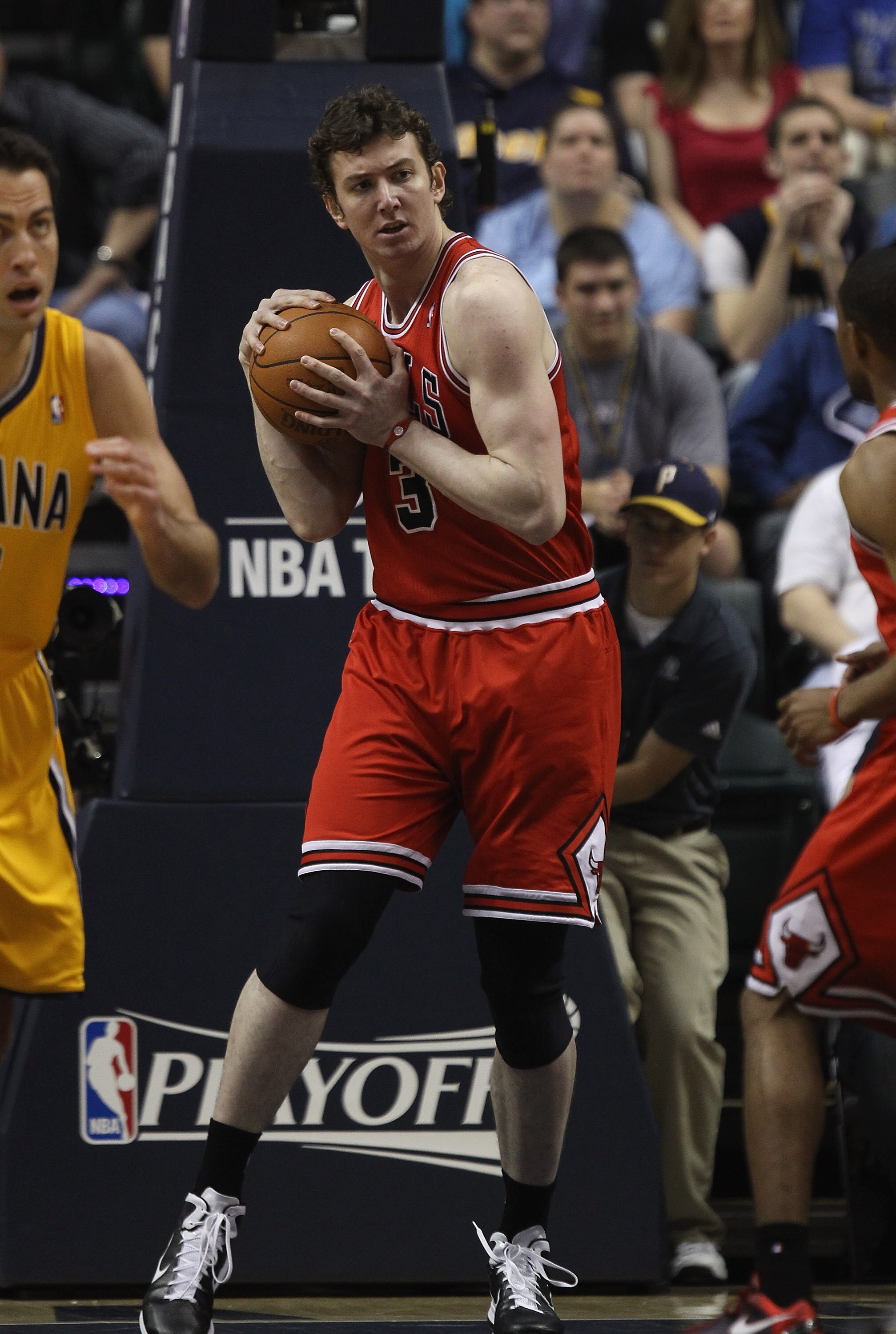 INDIANAPOLIS, IN - APRIL 23: Omer Asik #3 of the Chicago Bulls grabs a rebound against the Indiana Pacers in Game Four of the Eastern Conference Quarterfinals in the 2011 NBA Playoffs at Conseco Fieldhouse on April 23, 2011 in Indianapolis, Indiana. The P