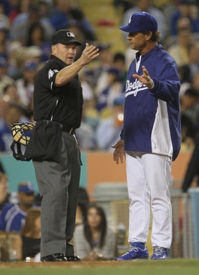 LOS ANGELES - MAY 2:  Manager Don Mattingly of the Los Angeles Dodgers argues with home plate umpire Jerry Meals during the game with the Chicago Cubs  on May 2, 2011 at Dodger Stadium in Los Angeles, California.  (Photo by Stephen Dunn/Getty Images)