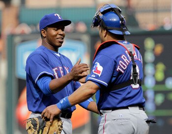 BALTIMORE, MD - APRIL 10:  Relief pitcher Neftali Feliz #30 of the Texas Rangers is congratulated by catcher Yorvit Torrealba #8 after the Rangers defeated the Baltimore Orioles 3-0 at Oriole Park at Camden Yards on April 10, 2011 in Baltimore, Maryland.