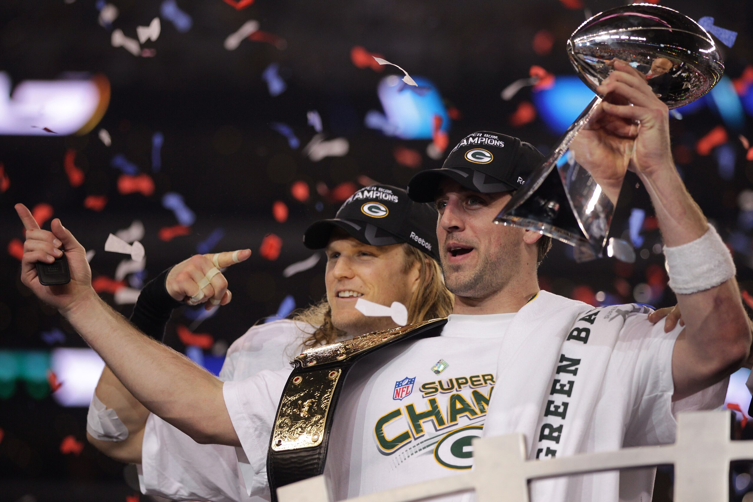 ARLINGTON, TX - FEBRUARY 06:  Aaron Rodgers #12 and Clay Matthews #52 of the Green Bay Packers of the Green Bay Packers holds the Lombardi Trophy after defeating the Pittsburgh Steelers 31-25 during Super Bowl XLV at Cowboys Stadium on February 6, 2011 in