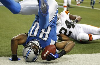 DETROIT - AUGUST 28:  Bryant Johnson #80 of the Detroit Lions scores a first quarter touchdown behind Sheldon Brown #24 of the Cleveland Browns during a preseason game on August 28, 2010 at Ford Field in Detroit, Michigan.  (Photo by Gregory Shamus/Getty
