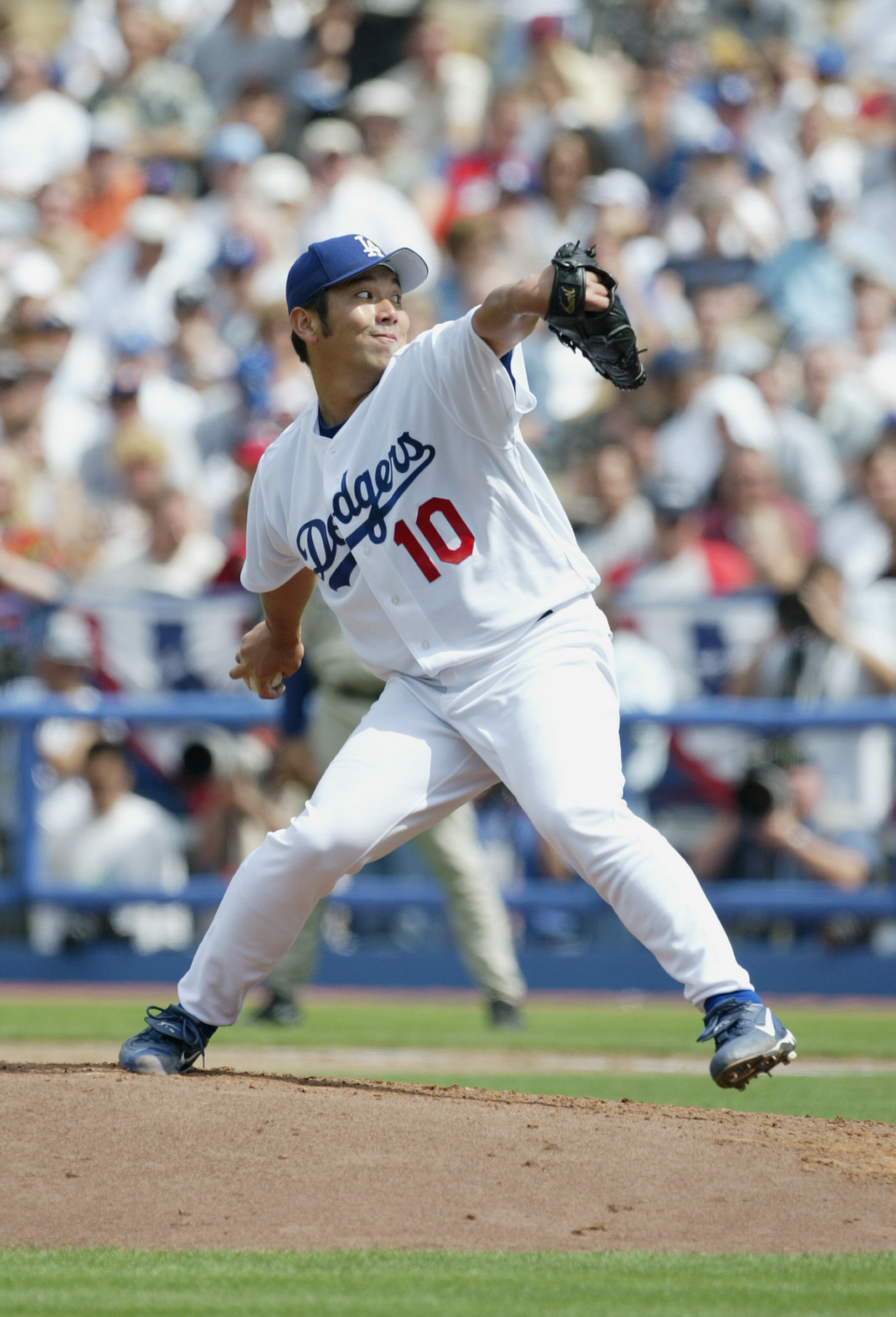 LOS ANGELES - APRIL 5:  Pitcher Hideo Nomo #10 of the Los Angeles Dodgers winds back to pitch during the game against the San Diego Padres on April 5, 2004 at Dodger Stadium in Los Angeles, California. The Padres defeated the Dodgers 8-2 in the season ope