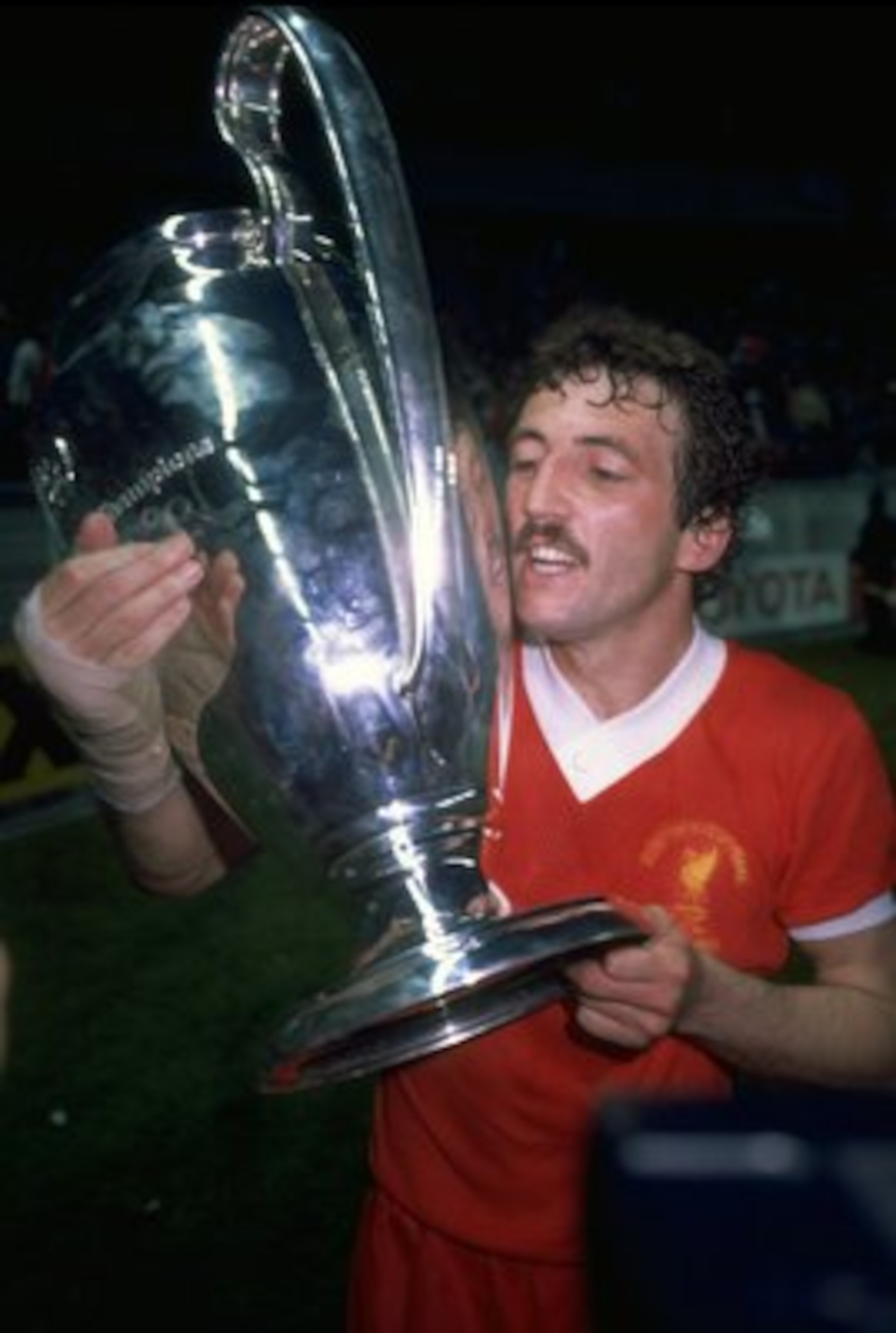 27 May 1981:  Alan Kennedy of Liverpool who scored the only goal of the match kisses the trophy after the European Cup final between Liverpool and Real Madrid in Paris. Liverpool won the match 1-0.                            \ Mandatory Credit: Allsport U