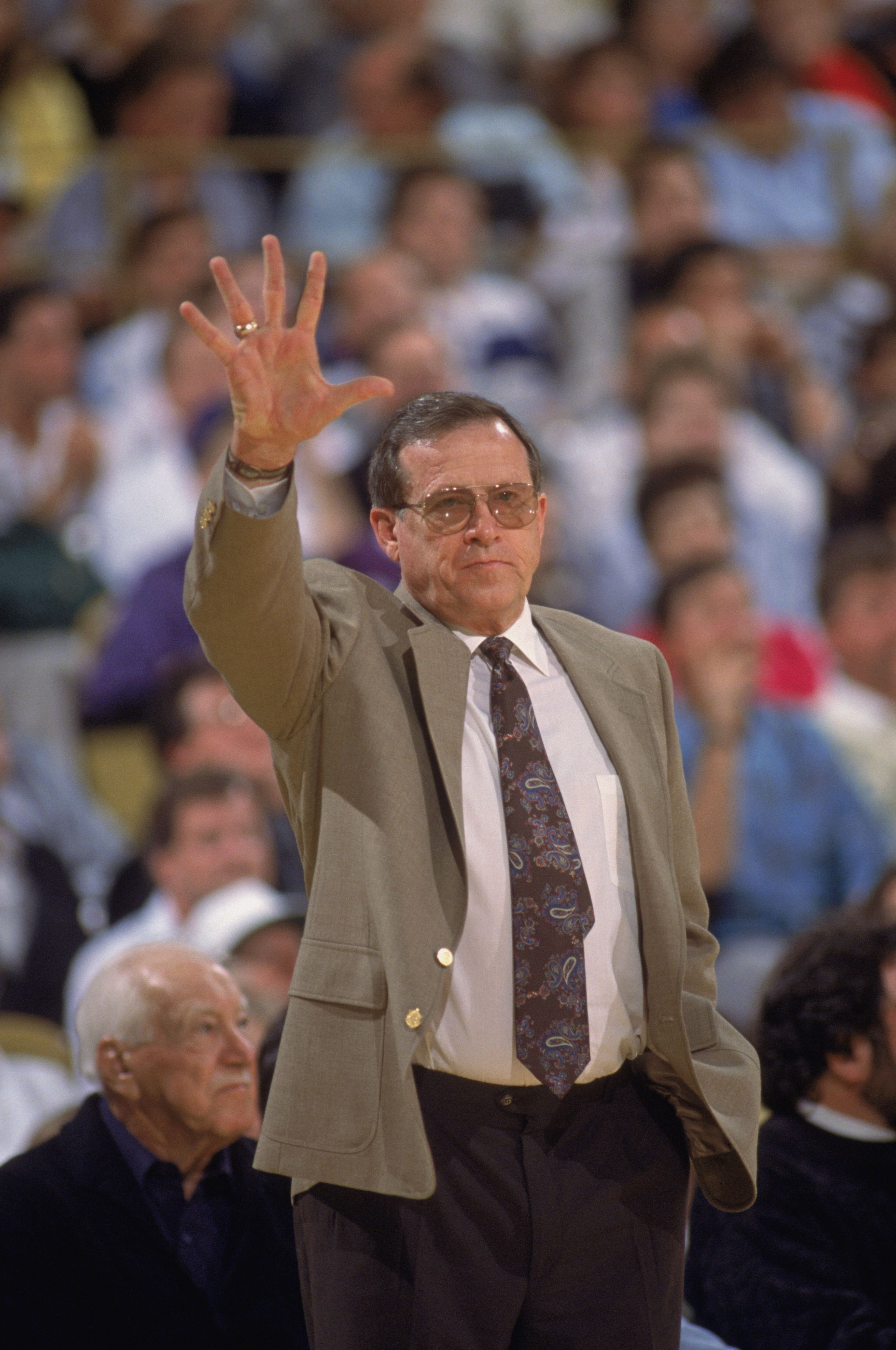 SACRAMENTO - 1990:  Head coach Dick Motta of the Sacramento Kings calls out a play on the sideline during an NBA game at Arco Arena in Sacramento, California in 1990. (Photo by Ken Levine/Getty Images)