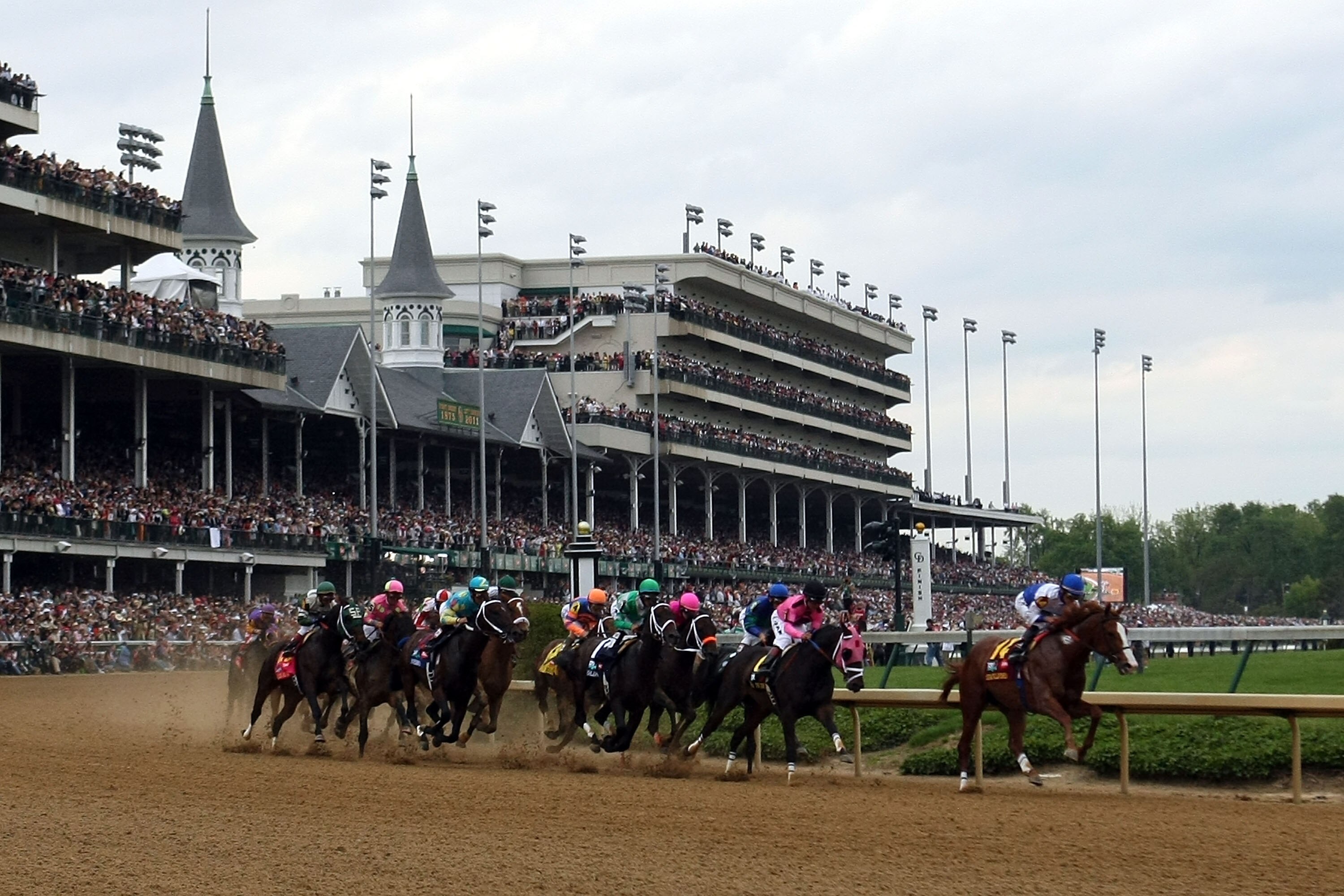 LOUISVILLE, KY - MAY 07:  Jockey Jesus L. Castanon (R), riding Shackleford #14, leads the field through turn one during the 137th Kentucky Derby at Churchill Downs on May 7, 2011 in Louisville, Kentucky.  (Photo by Al Bello/Getty Images)