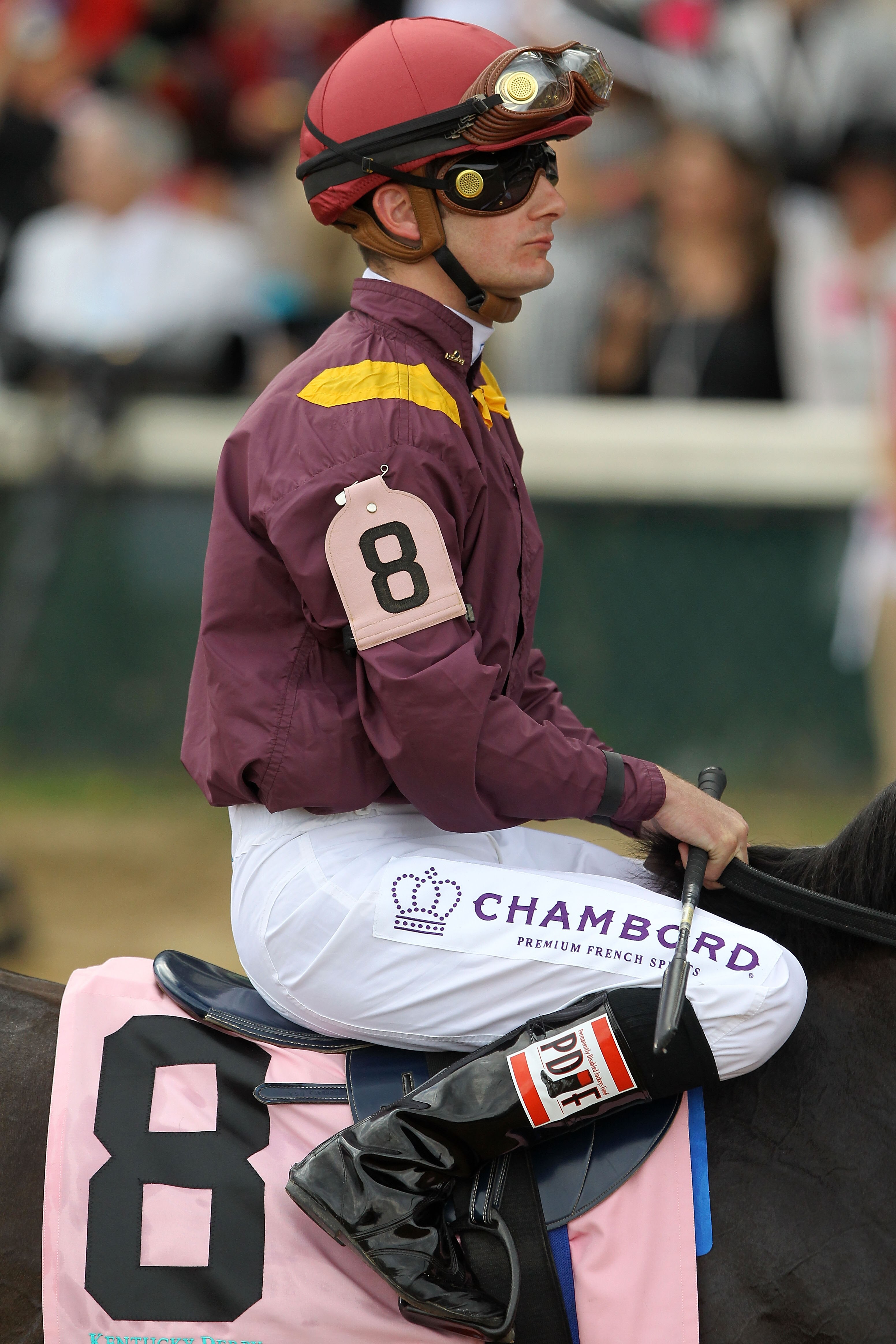 LOUISVILLE, KY - MAY 07:  Jockey Julien R. Leparoux, riding Dialed In #8, is escourted onto the track for the running of the 137th Kentucky Derby at Churchill Downs on May 7, 2011 in Louisville, Kentucky.  (Photo by Matthew Stockman/Getty Images)