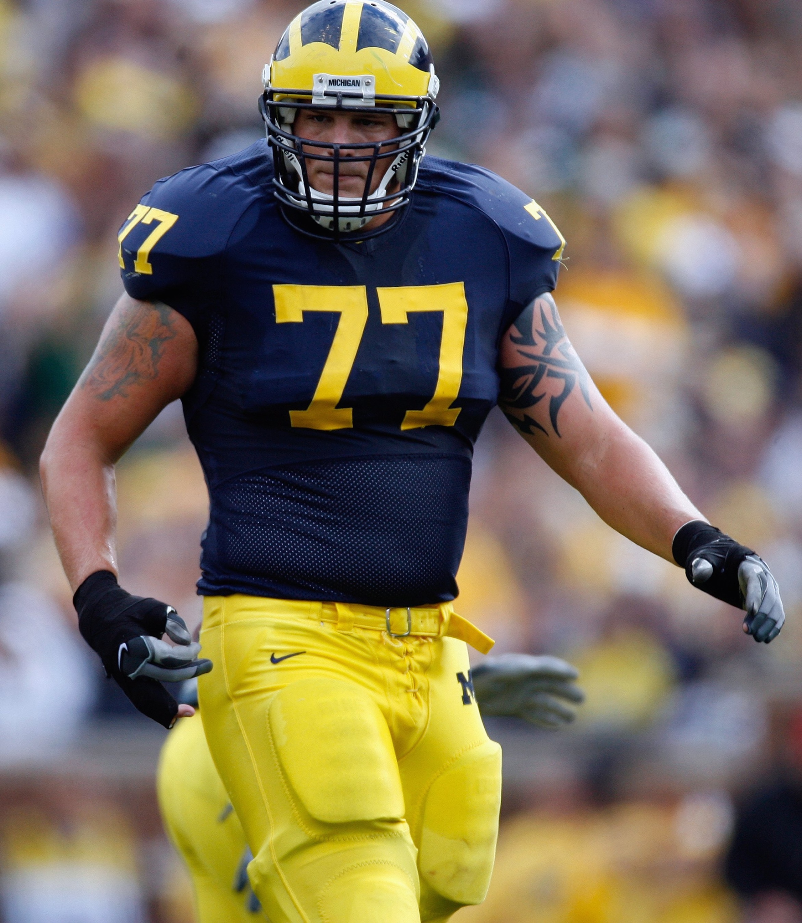ANN ARBOR, MI - SEPTEMBER 15:  Jake Long #77 of the Michigan Wolverines looks on during the game against the Notre Dame Fighting Irish on September 15, 2007 at Michigan Stadium in Ann Arbor, Michigan. Michigan won 38-0. (Photo by Gregory Shamus/Getty Imag