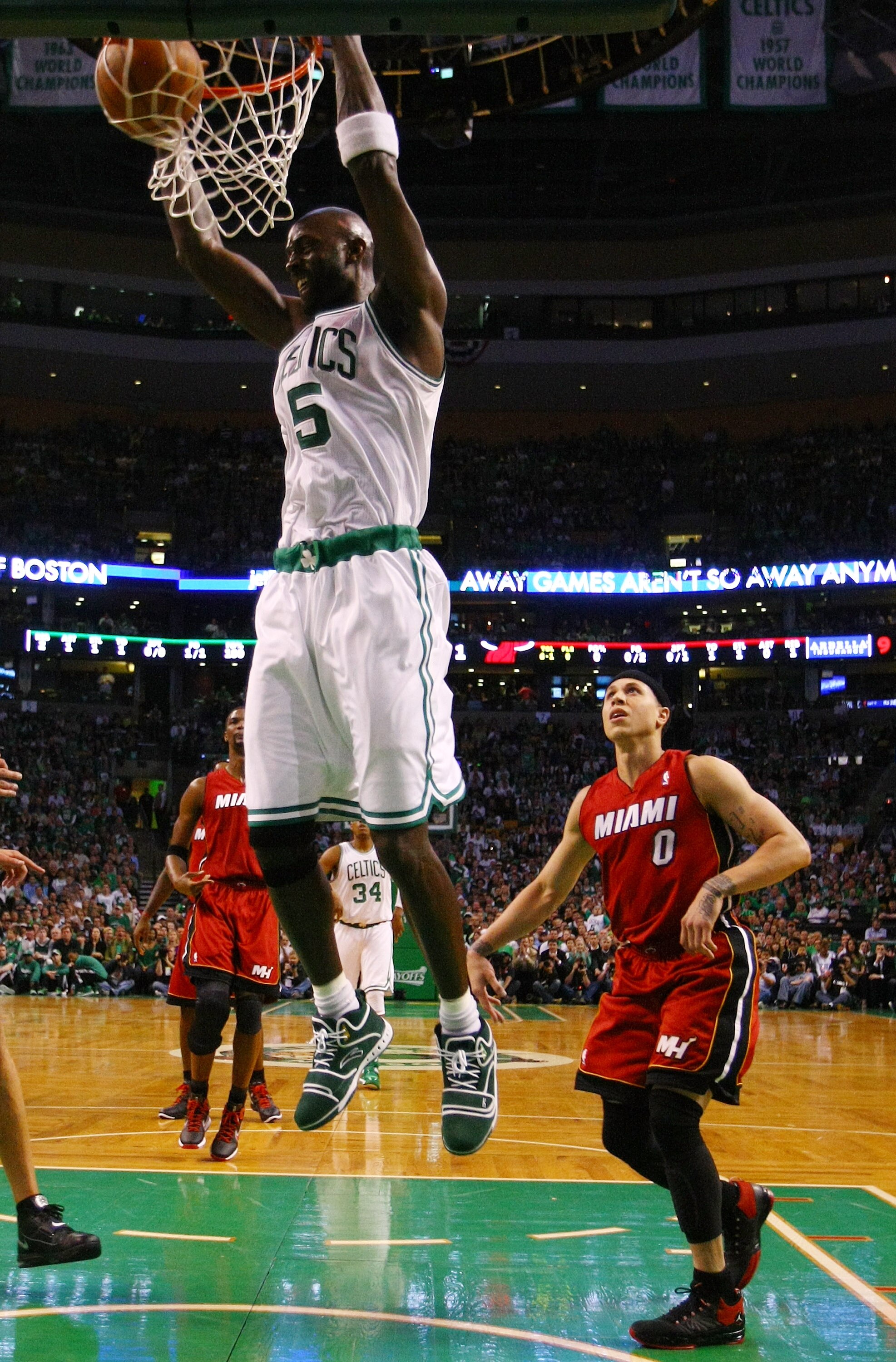 BOSTON, MA - MAY 07: Kevin Garnett #5 of the Boston Celtics dunks the ball as Mike Bibby #0 of the Miami Heat defends in Game Three of the Eastern Conference Semifinals in the 2011 NBA Playoffs on May 7, 2011 at the TD Garden in Boston, Massachusetts.  NO