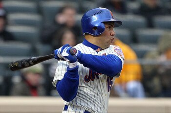 NEW YORK, NY - APRIL 08:  Carlos Beltran #15 of the New York Mets hits a double in the bottom of the sixth inning against the Washington Nationals during the Mets' Home Opener at Citi Field on April 8, 2011 in the Flushing neighborhood of Queens in New Yo