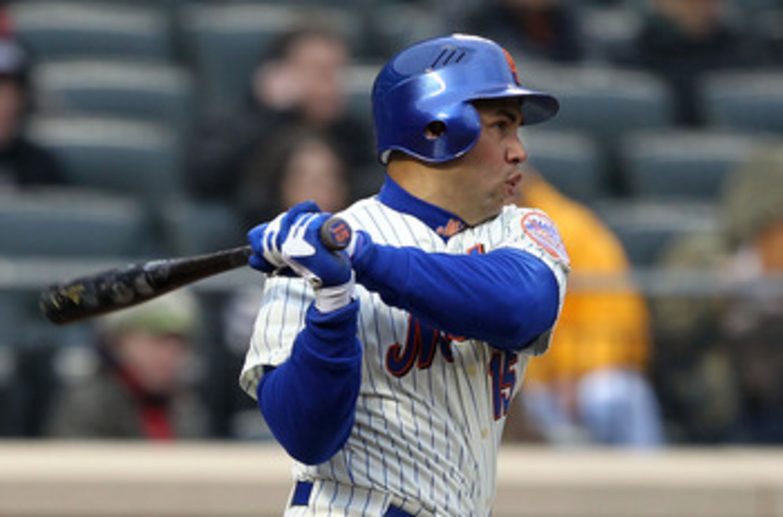 NEW YORK, NY - APRIL 08:  Carlos Beltran #15 of the New York Mets hits a double in the bottom of the sixth inning against the Washington Nationals during the Mets' Home Opener at Citi Field on April 8, 2011 in the Flushing neighborhood of Queens in New Yo