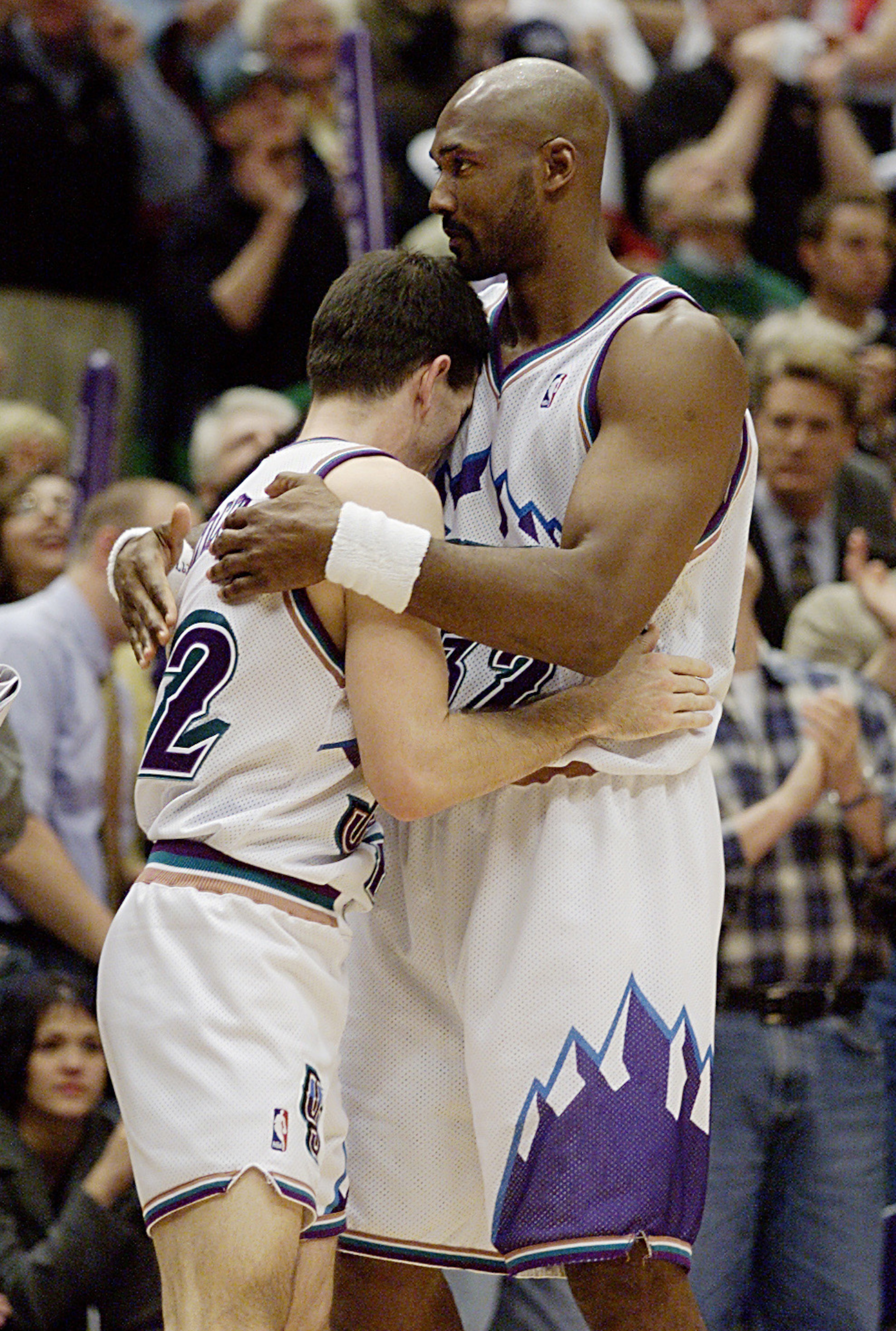21 Apr 2001: Karl Malone #32 gives John Stockton #12 of the Utah Jazz a hug after they escaped with an 88-86 win over the Dallas Mavericks during their first round playoff game at the Delta Center in Salt Lake City, Utah. <DIGITAL IMAGE> Mandatory Credi 21 Apr 2001: Karl Malone #32 gives John Stockton #12 of the Utah Jazz a hug after they escaped with an 88-86 win over the Dallas Mavericks during their first round playoff game at the Delta Center in Salt Lake City, Utah. <DIGITAL IMAGE> Mandatory Credi