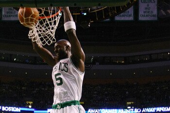 BOSTON, MA - MAY 07: Kevin Garnett #5 of the Boston Celtics dunks the ball as Mike Bibby #0 of the Miami Heat defends in Game Three of the Eastern Conference Semifinals in the 2011 NBA Playoffs on May 7, 2011 at the TD Garden in Boston, Massachusetts.  NO
