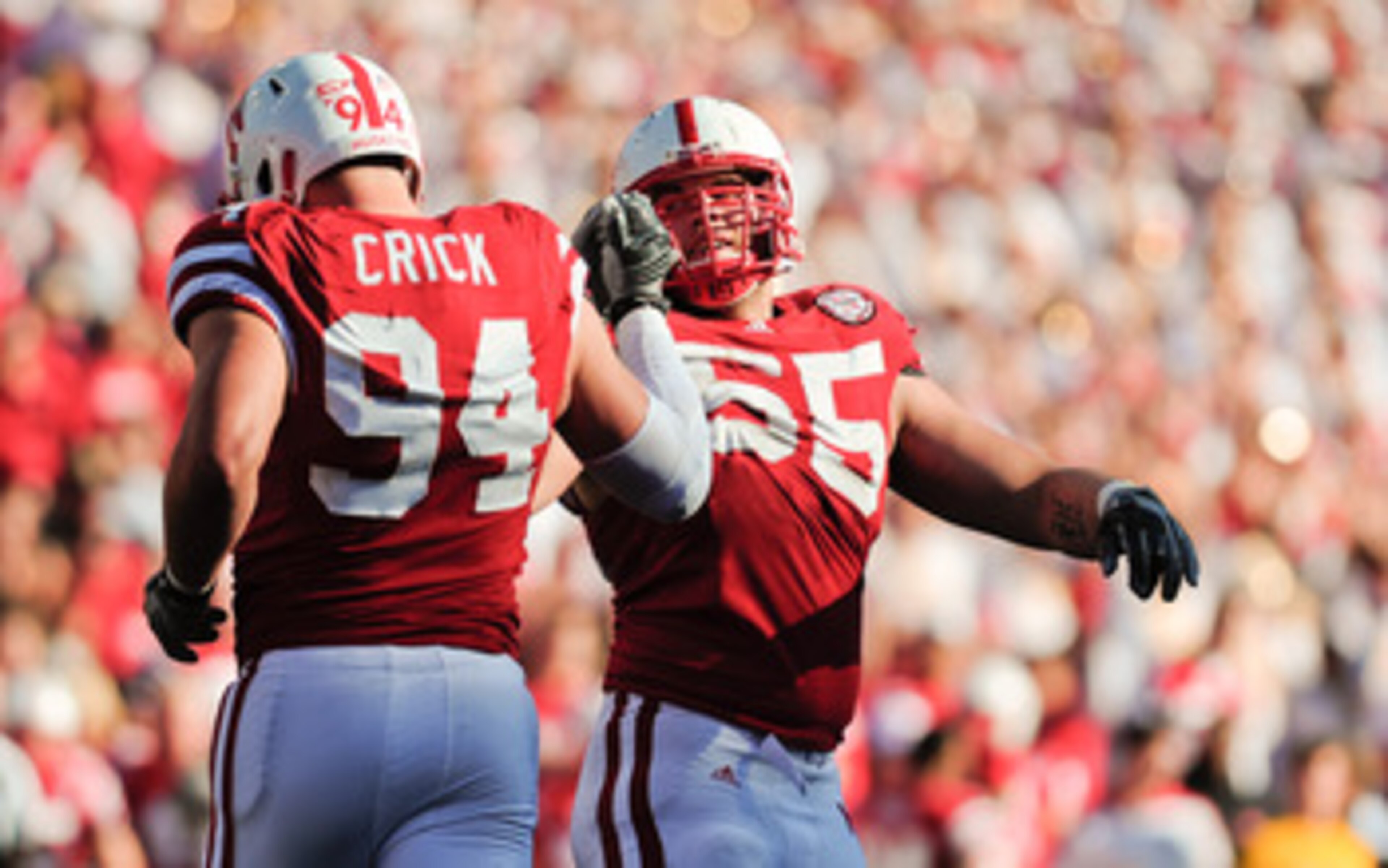 LINCOLN, NE - OCTOBER 30: Defensive tackle Baker Steinkuhler #55 of the Nebraska Cornhuskers high fives teammate defensive tackle Jared Crick #94 after a third down stop during second half action of their game at Memorial Stadium on October 30, 2010 in LINCOLN, NE - OCTOBER 30: Defensive tackle Baker Steinkuhler #55 of the Nebraska Cornhuskers high fives teammate defensive tackle Jared Crick #94 after a third down stop during second half action of their game at Memorial Stadium on October 30, 2010 in