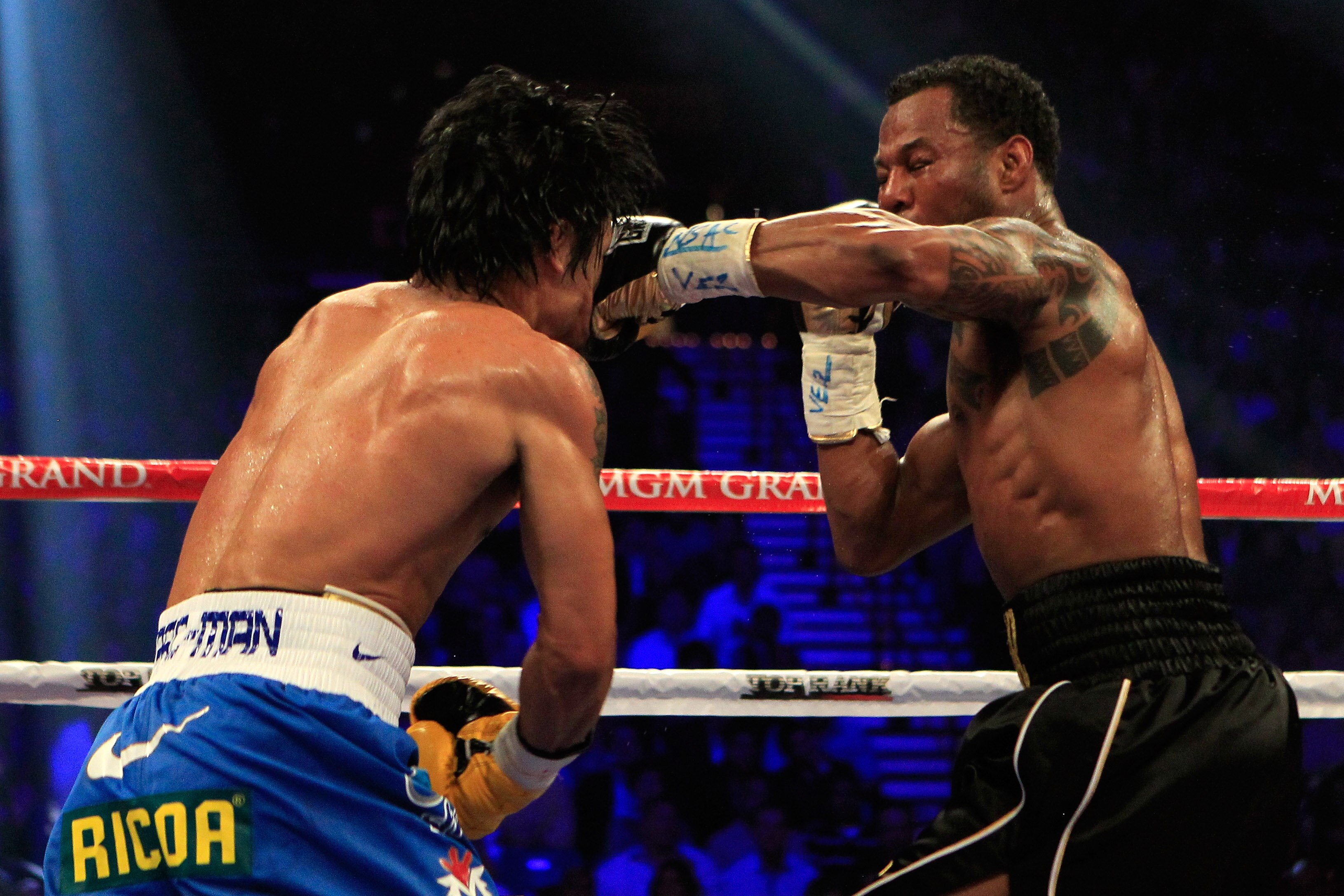 LAS VEGAS, NV - MAY 07:  (R-L) Shane Mosley connects with a left to the face of Manny Pacquiao of the Philippines in the WBO welterweight title fight at MGM Grand Garden Arena on May 7, 2011 in Las Vegas, Nevada.  (Photo by Chris Trotman/Getty Images)