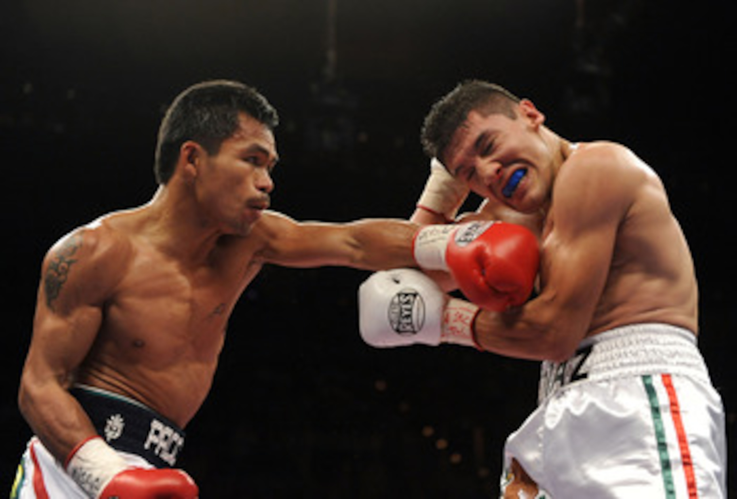 LAS VEGAS - JUNE 28:  Manny Pacquiao of the Phillipines lands a left on David Diaz during the first round of the WBC Lightweight Championship at the Mandalay Bay Events Center on June 28, 2008 in Las Vegas, Nevada.  Pacquiao would go on to win in a ninth