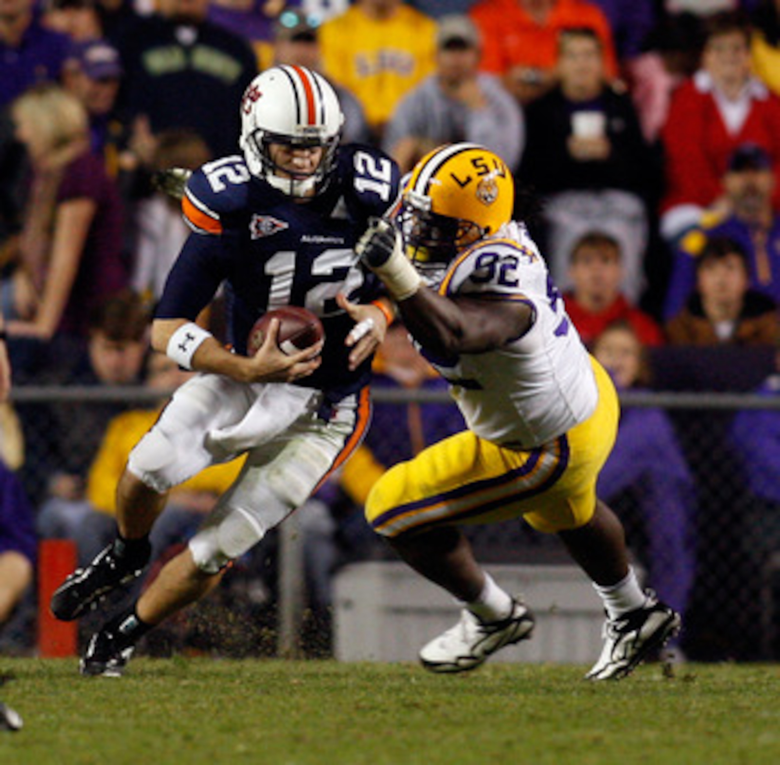 BATON ROUGE, LA - OCTOBER 24: Quarterback Chris Todd #12 of the Auburn Tigers is sacked by Drake Nevis #92 of the Louisiana State University Tigers at Tiger Stadium on October 24, 2009 in Baton Rouge, Louisiana. (Photo by Chris Graythen/Getty Images) BATON ROUGE, LA - OCTOBER 24: Quarterback Chris Todd #12 of the Auburn Tigers is sacked by Drake Nevis #92 of the Louisiana State University Tigers at Tiger Stadium on October 24, 2009 in Baton Rouge, Louisiana. (Photo by Chris Graythen/Getty Images)