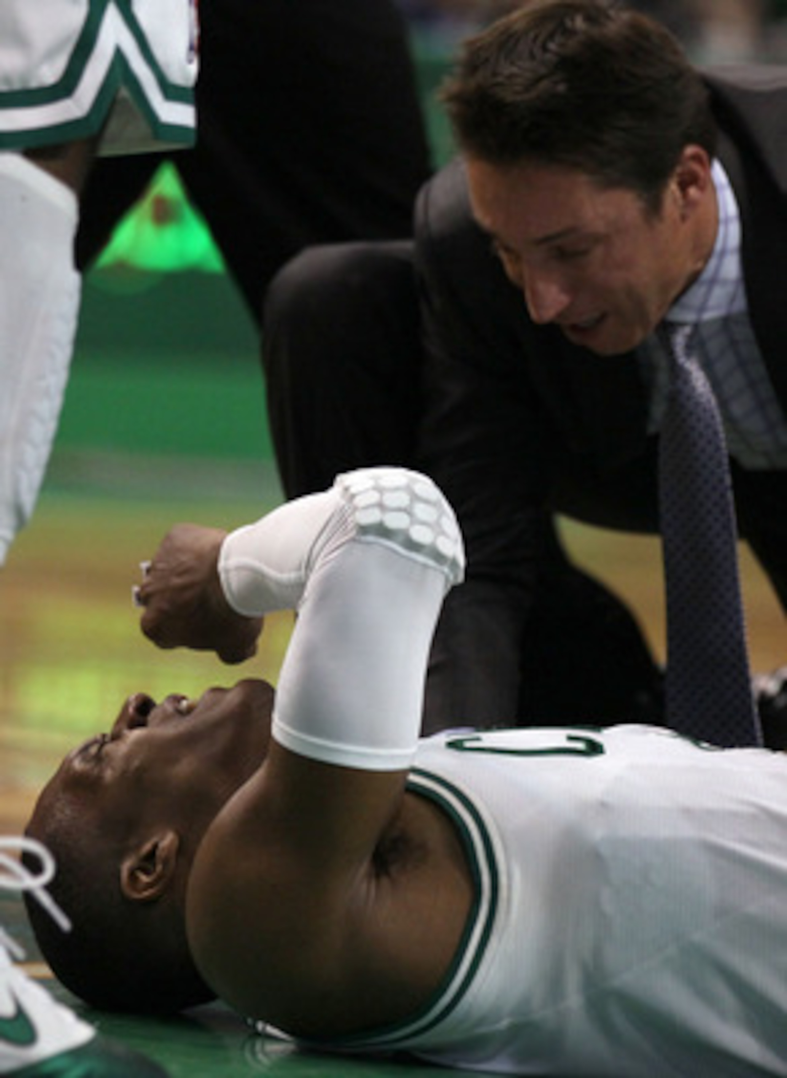 BOSTON, MA - MAY 07: Rajon Rondo #9 of the Boston Celtics is tended to after a scramble with Dwyane Wade #3 of the Miami Heat in Game Three of the Eastern Conference Semifinals in the 2011 NBA Playoffs on May 7, 2011 at the TD Garden in Boston, Massachuse BOSTON, MA - MAY 07: Rajon Rondo #9 of the Boston Celtics is tended to after a scramble with Dwyane Wade #3 of the Miami Heat in Game Three of the Eastern Conference Semifinals in the 2011 NBA Playoffs on May 7, 2011 at the TD Garden in Boston, Massachuse