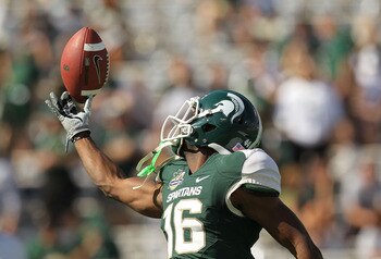ORLANDO, FL - JANUARY 01:  Chris Rucker #16 of the Michigan State Spartans warms up during the Capitol One Bowl against the Alabama Crimson Tide at the Florida Citrus Bowl on January 1, 2011 in Orlando, Florida.  (Photo by Mike Ehrmann/Getty Images)
