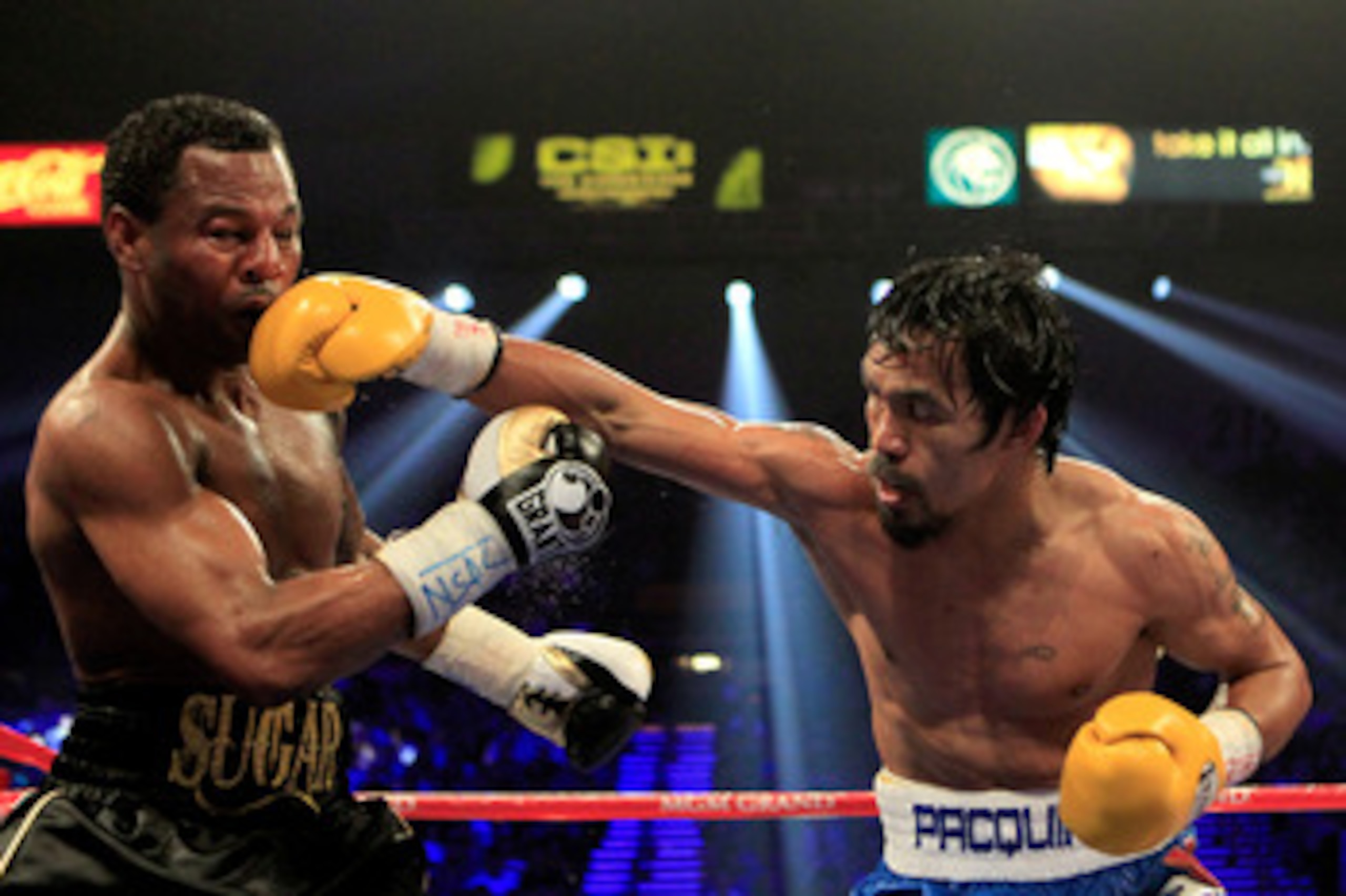 LAS VEGAS, NV - MAY 07:  (R-L) Manny Pacquiao of the Philippines connects with a right to the head of Shane Mosley in the WBO welterweight title fight at MGM Grand Garden Arena on May 7, 2011 in Las Vegas, Nevada.  (Photo by Chris Trotman/Getty Images)