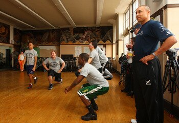 NEW YORK - MARCH 11:  Former New York Knick and Laureus Friend & Ambassador John Starks looks on as high school students take part in boot camp drills during the I CHALLENGE MYSELF New York Project visit on March 11, 2009 at George Washington Educational 