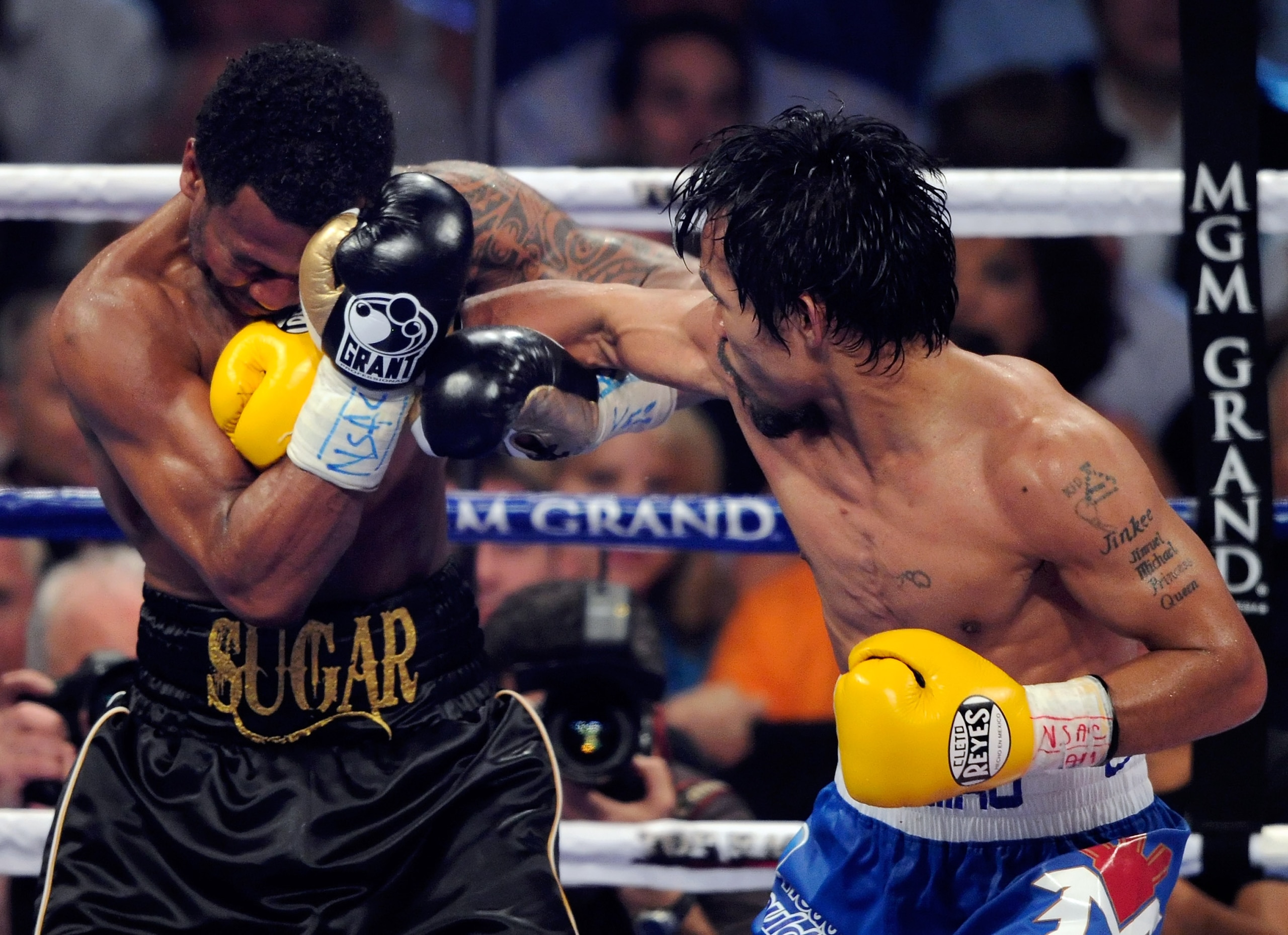 LAS VEGAS, NV - MAY 07:  Manny Pacquiao (R) hits Shane Mosley in the 10th round of their WBO welterweight title fight at the MGM Grand Garden Arena May 7, 2011 in Las Vegas, Nevada. Pacquiao retained his title with a unanimous-decision victory.  (Photo by