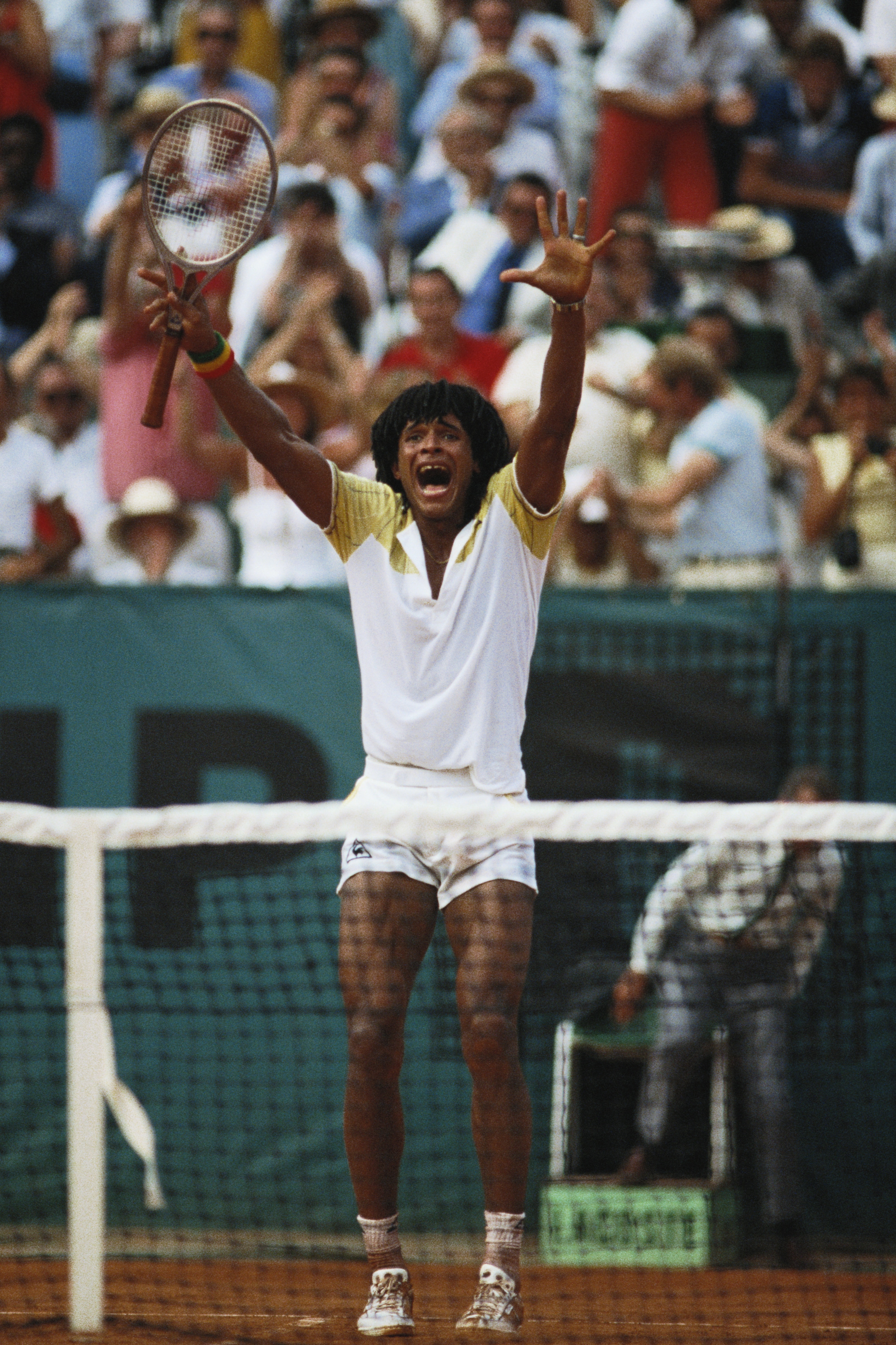 Yannick Noah of France raises his arms in celebration after defeating Mats Wilander in the Men's Singles final match during the French Open Tennis Championship on 5th June 1983 at the Stade Roland Garros Stadium in Paris, France. (Photo by Steve Powell/Ge