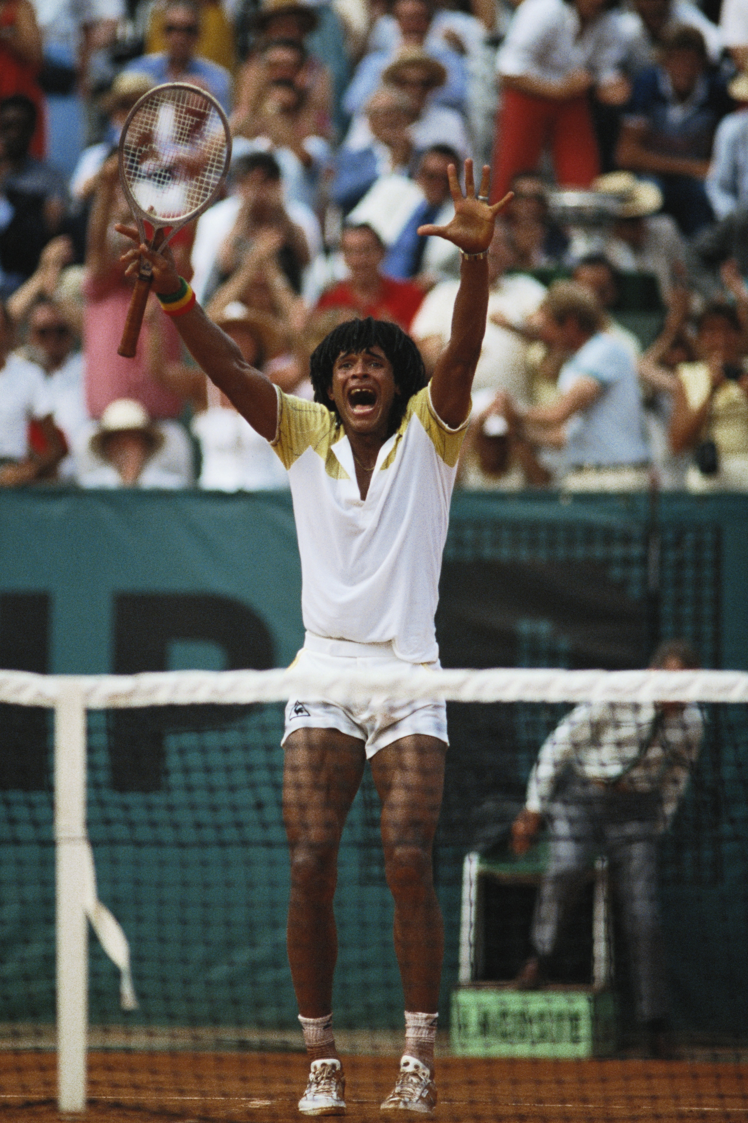 Yannick Noah of France raises his arms in celebration after defeating Mats Wilander in the Men's Singles final match during the French Open Tennis Championship on 5th June 1983 at the Stade Roland Garros Stadium in Paris, France. (Photo by Steve Powell/Ge