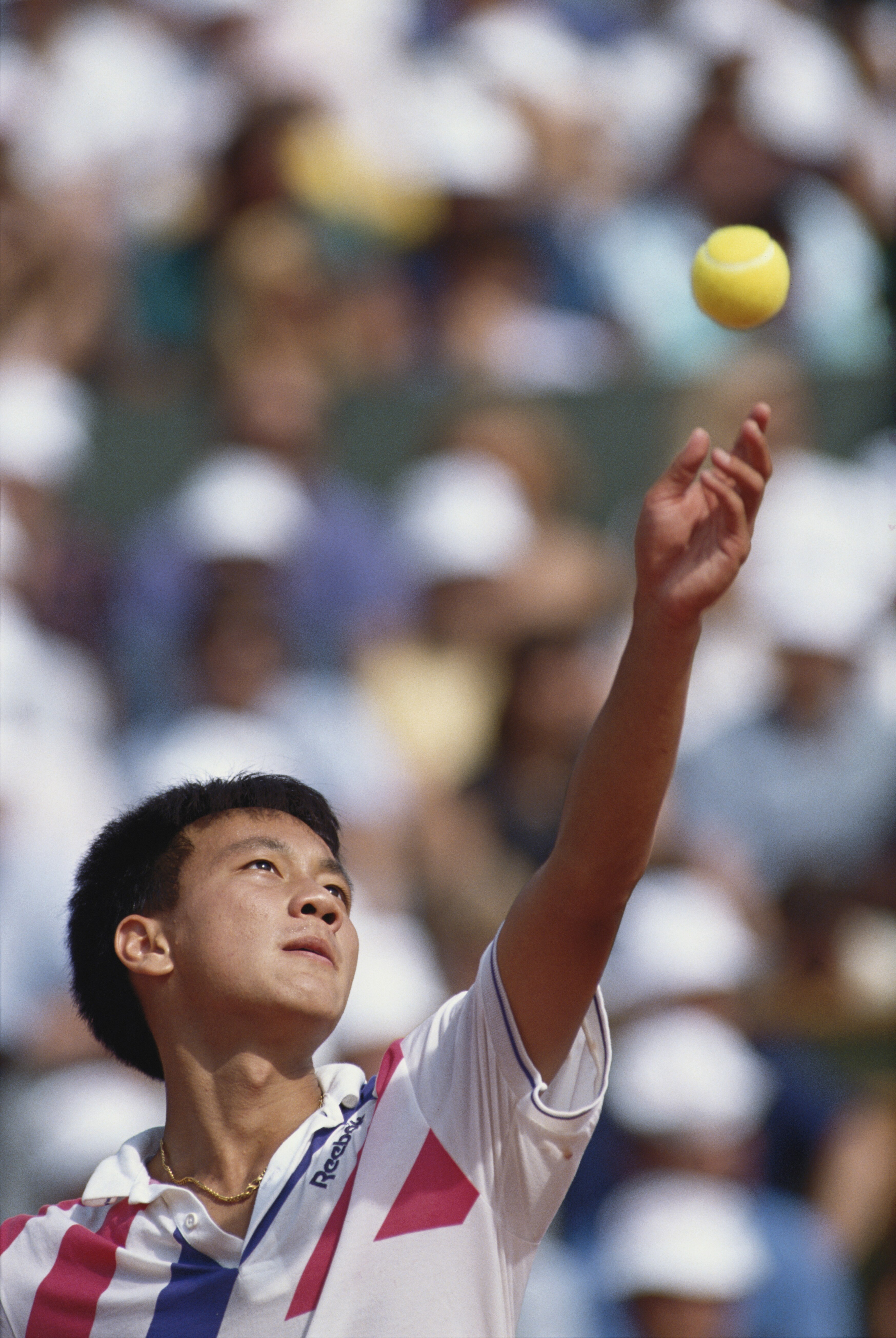 Michael Chang of the United States keeps his eyes on the ball as he prepares to serve to Stefan Edberg during the Men's Singles final match at the French Open Tennis Championship on 11th  June 1989 at the Stade Roland Garros Stadium in Paris, France.(Phot