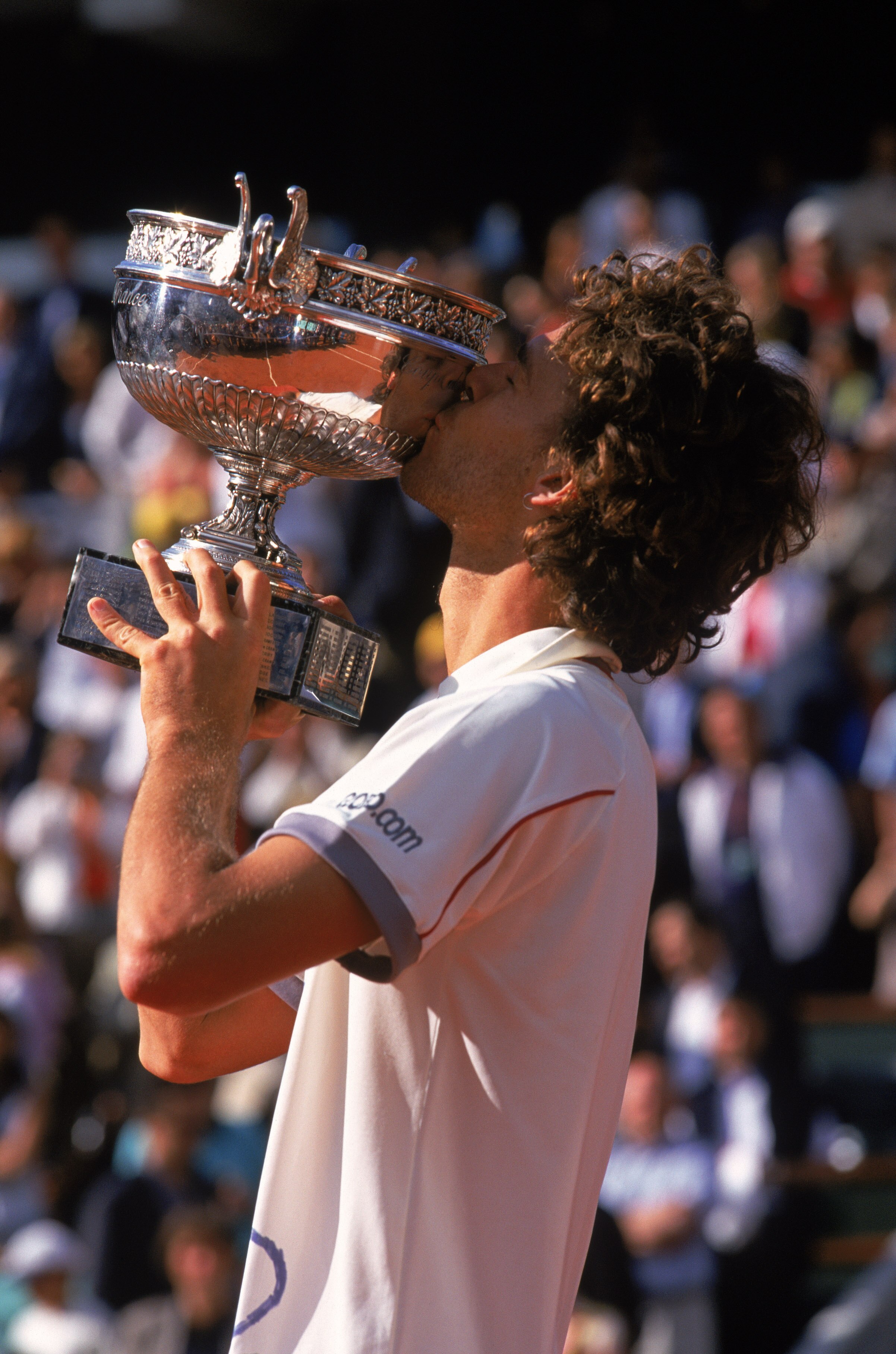 10 Jun 2001:  Gustavo Kuerten of Brazil kisses the trophy during the French Open at Roland Garros Tennis Stadium in Paris, France.  Kuerten won the tournament, his third French Open victory.\ Mandatory Credit:  Alex Livesey/Getty Images