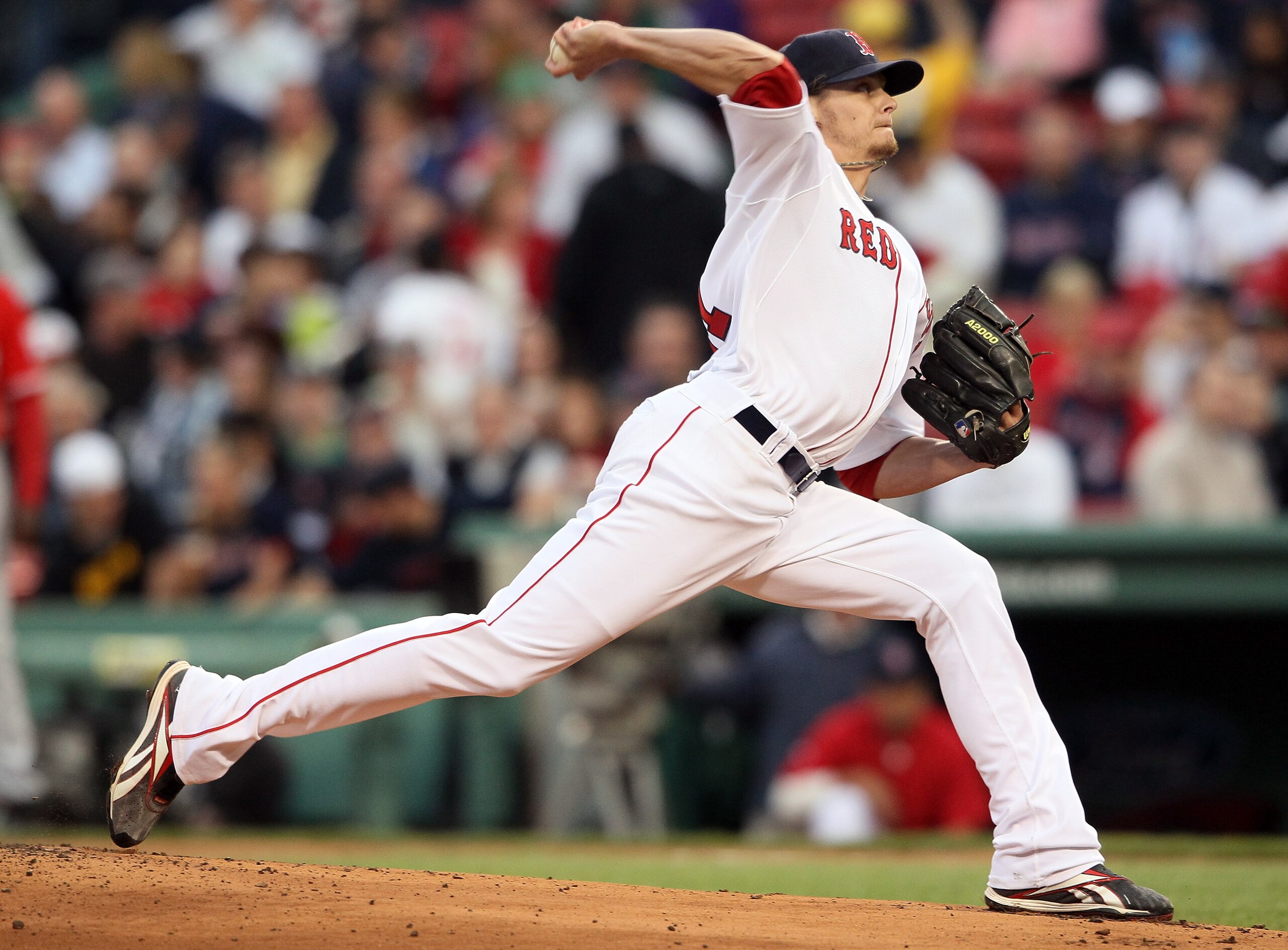 BOSTON, MA - MAY 02:  Clay Buchholz #11 of the Boston Red Sox delivers a pitch in the first inning against the Los Angeles Angels on May 2, 2011 at Fenway Park in Boston, Massachusetts.  (Photo by Elsa/Getty Images)