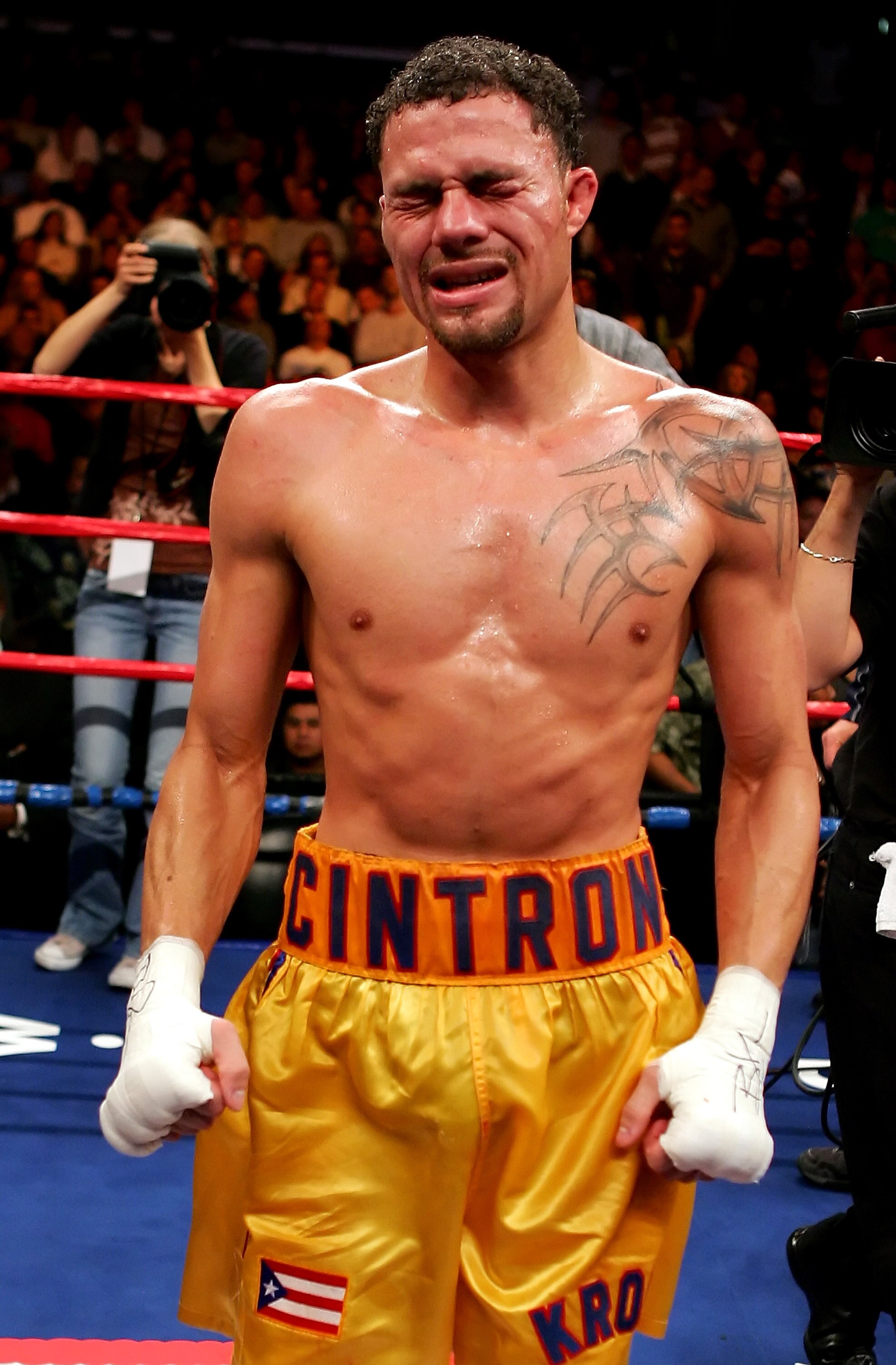 LOS ANGELES, CA - NOVEMBER 23:  Kermit Cintron grimaces in pain after his victory over Jesse Feliciano in the IBF Welterweight title fight at Staples Center on November 23, 2007 in Los Angeles, California.  Cintron won the fight by way of TKO in the 10th