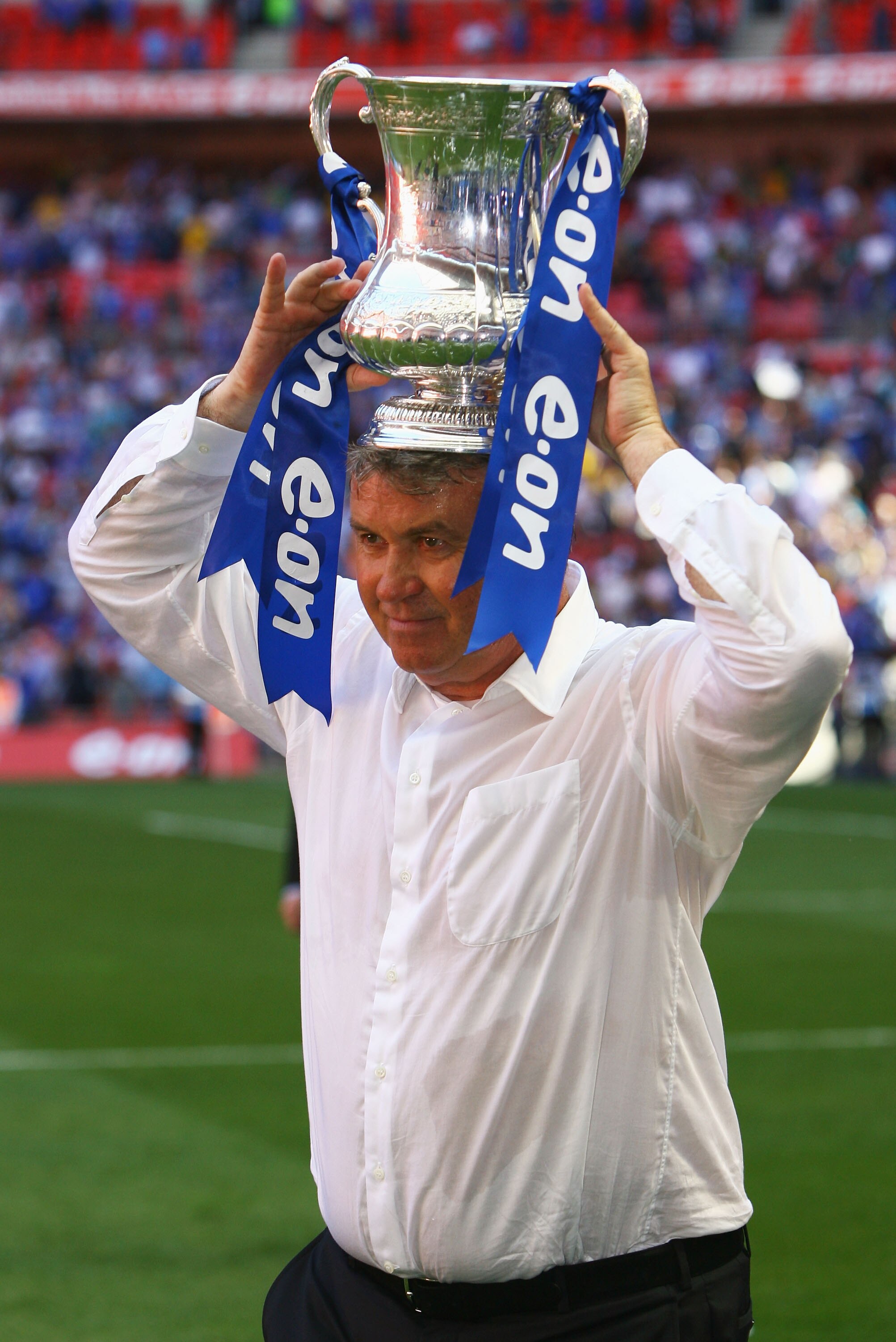 LONDON, ENGLAND - MAY 30: Chelsea Manager Guus Hiddink lifts the trophy after the FA Cup sponsored by E.ON Final match between Chelsea and Everton at Wembley Stadium on May 30, 2009 in London, England. (Photo by Alex Livesey/Getty Images) LONDON, ENGLAND - MAY 30: Chelsea Manager Guus Hiddink lifts the trophy after the FA Cup sponsored by E.ON Final match between Chelsea and Everton at Wembley Stadium on May 30, 2009 in London, England. (Photo by Alex Livesey/Getty Images)