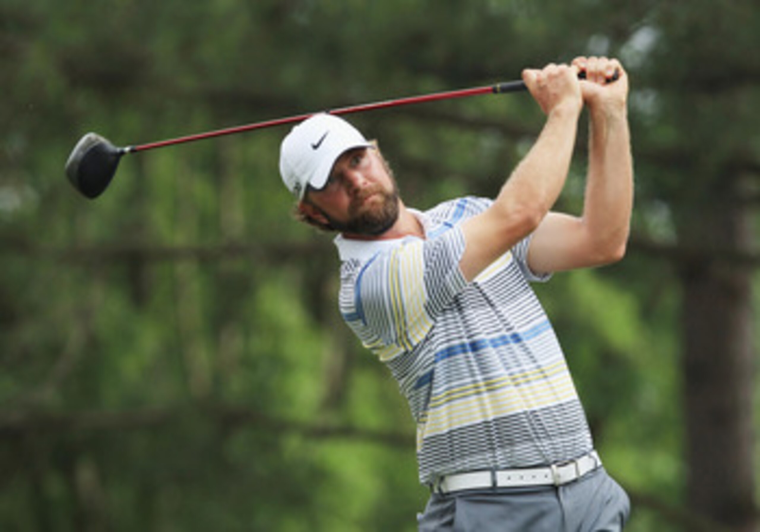 CHARLOTTE, NC - MAY 08:  Lucas Glover watches his tee his shot on the 18th hole during the final round of the Wells Fargo Championship at the Quail Hollow Club on May 8, 2011 in Charlotte, North Carolina.  (Photo by Streeter Lecka/Getty Images)