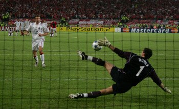 ISTANBUL, TURKEY - MAY 25:  Liverpool goalkeeper Jerzy Dudek of Poland saves the decisive penalty from AC Milan forward Andriy Shevchenko of Ukraine during a penalty shoot out during the European Champions League final between Liverpool and AC Milan on Ma
