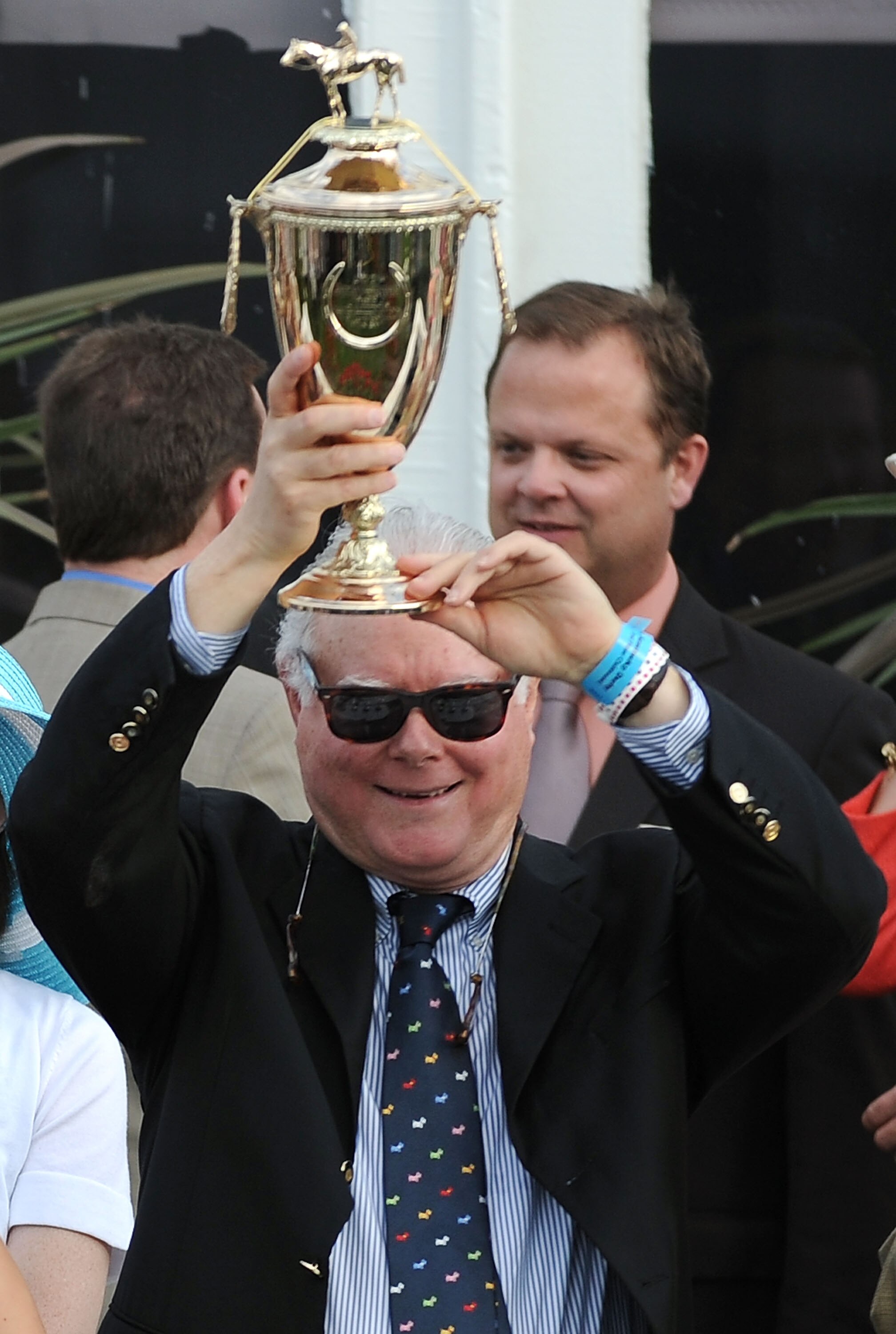 LOUISVILLE, KY - MAY 07:  Barry Irwin, owner of Animal Kingdom riden by John Velazquez, celebrates with the trophy in the winner's circle after they won the 137th Kentucky Derby at Churchill Downs on May 7, 2011 in Louisville, Kentucky.  (Photo by Harry H