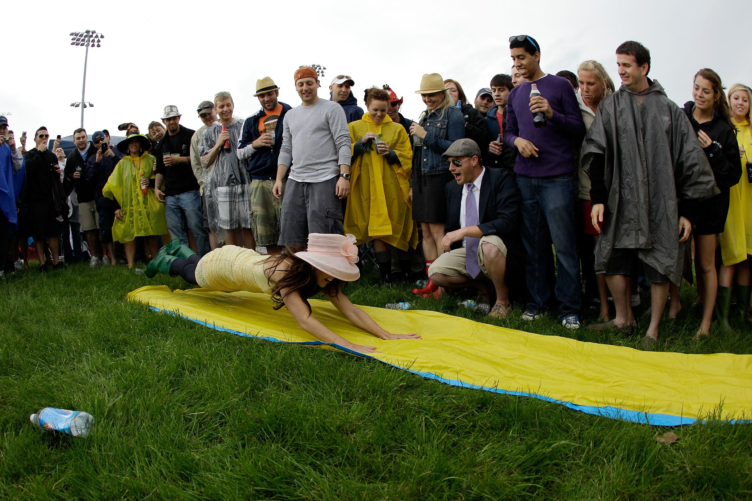 LOUISVILLE, KY - MAY 07:  Fans play on a slip and slide as they party in the infield during the 137th Kentucky Derby at Churchill Downs on May 7, 2011 in Louisville, Kentucky.  (Photo by Rob Carr/Getty Images)