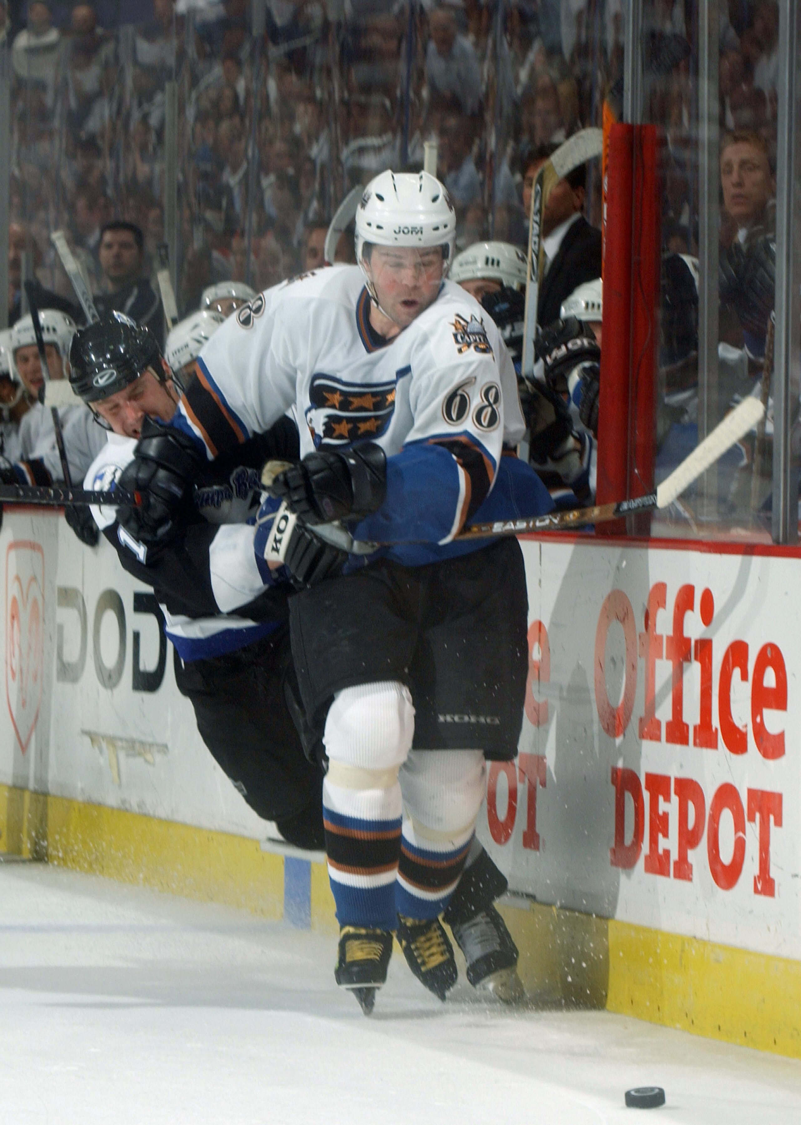 WASHINGTON - APRIL 15: Jaromir Jagr #68 of the Washington Capitals and Pavel Kubina #13 of the Tampa Bay Lightning battle for the puck in game three of the first round of the 2003 Eastern Conference Stanley Cup playoffs at the MCI Center on April 15, 200 WASHINGTON - APRIL 15: Jaromir Jagr #68 of the Washington Capitals and Pavel Kubina #13 of the Tampa Bay Lightning battle for the puck in game three of the first round of the 2003 Eastern Conference Stanley Cup playoffs at the MCI Center on April 15, 200